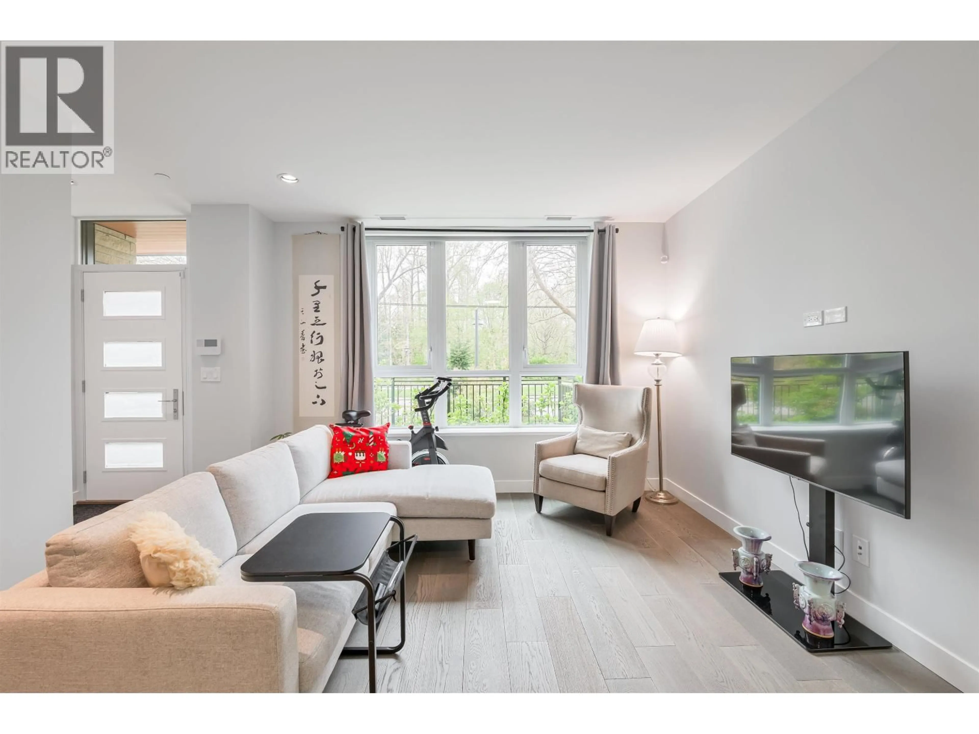 Living room with furniture, wood/laminate floor for 5336 UNIVERSITY BOULEVARD, Vancouver British Columbia V6T0C8