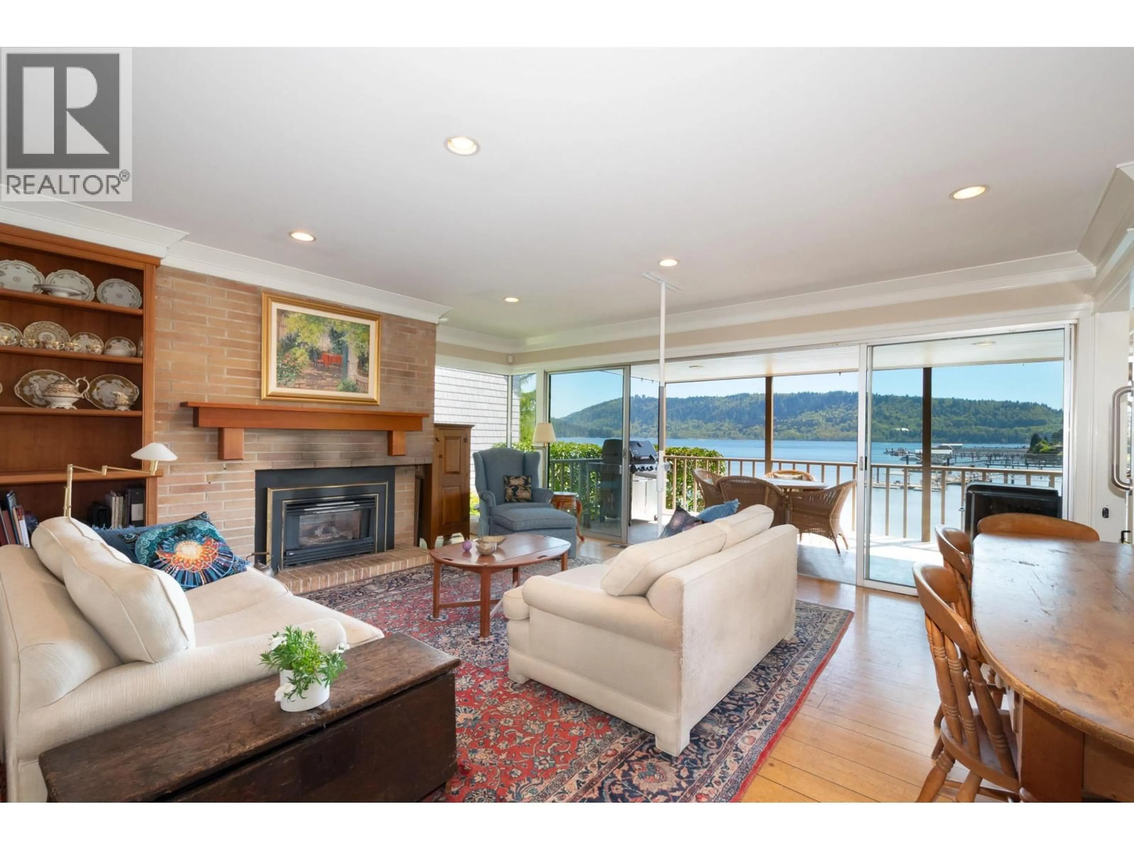 Living room with furniture, wood/laminate floor for 4455 HARRIS PLACE, North Vancouver British Columbia V7G1E9
