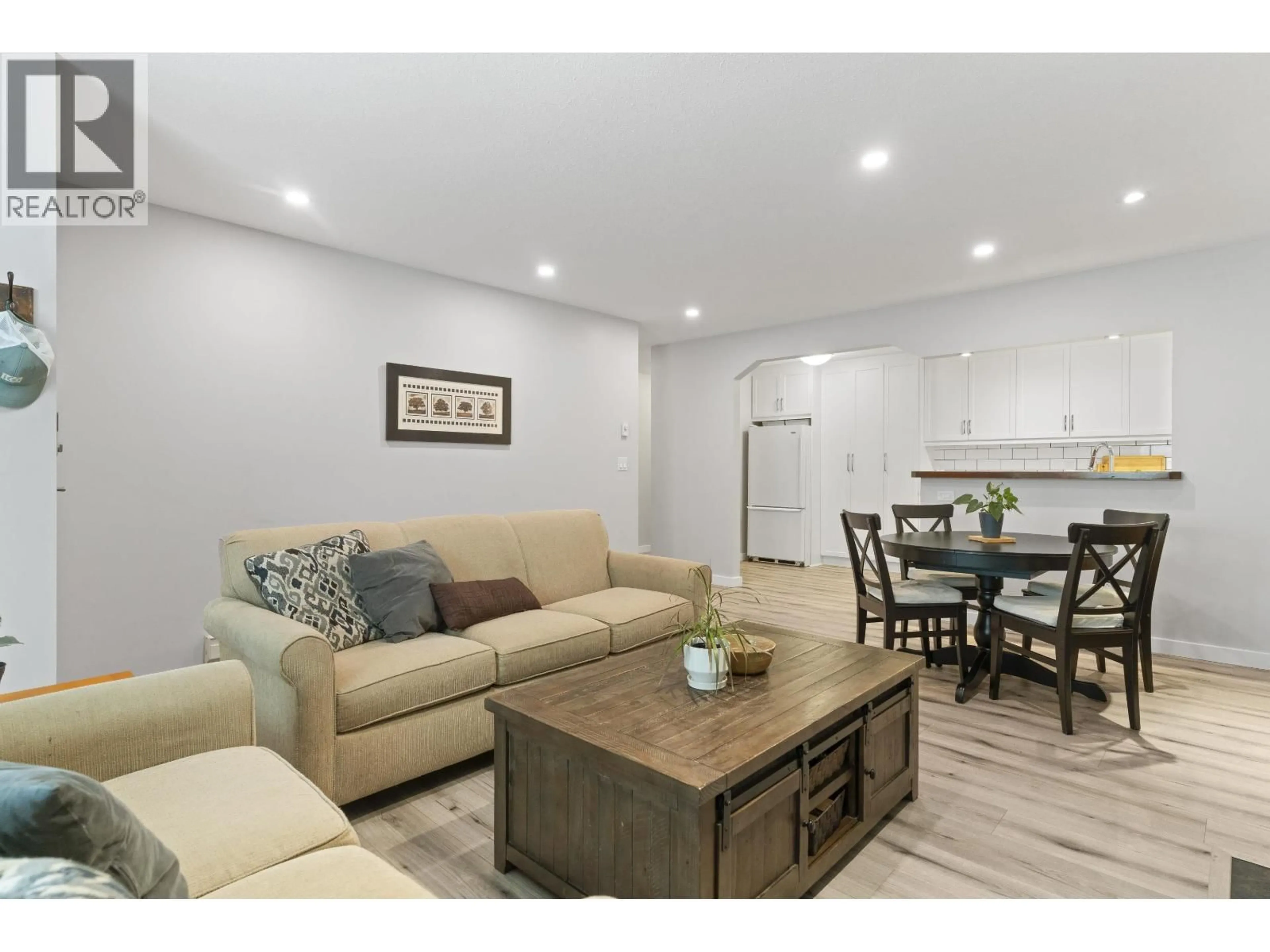Living room with furniture, wood/laminate floor for A102 - 4811 53 STREET, Delta British Columbia V4K2Z3
