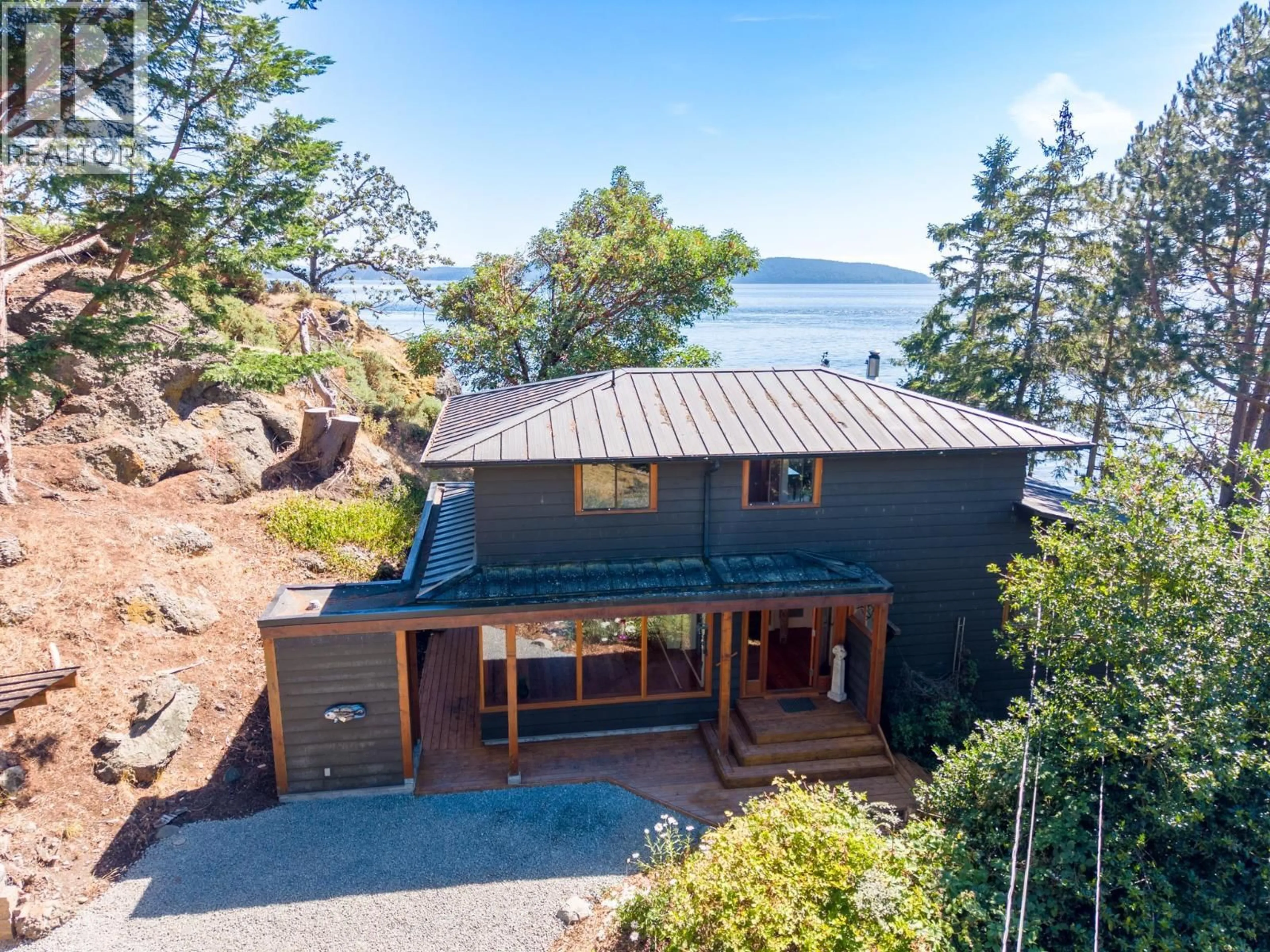 A pic from outside/outdoor area/front of a property/back of a property/a pic from drone, water/lake/river/ocean view for 9919 SOUTHLANDS DRIVE, Pender Island British Columbia V0N2M3