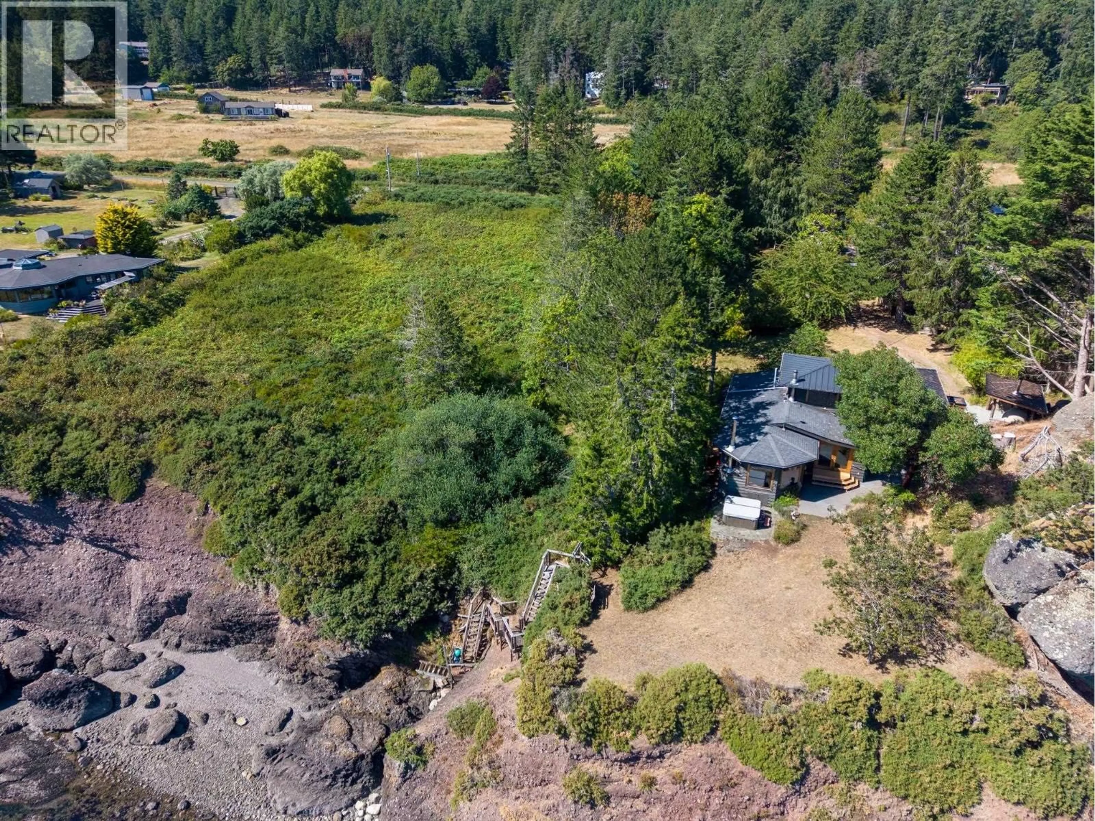 A pic from outside/outdoor area/front of a property/back of a property/a pic from drone, water/lake/river/ocean view for 9919 SOUTHLANDS DRIVE, Pender Island British Columbia V0N2M3