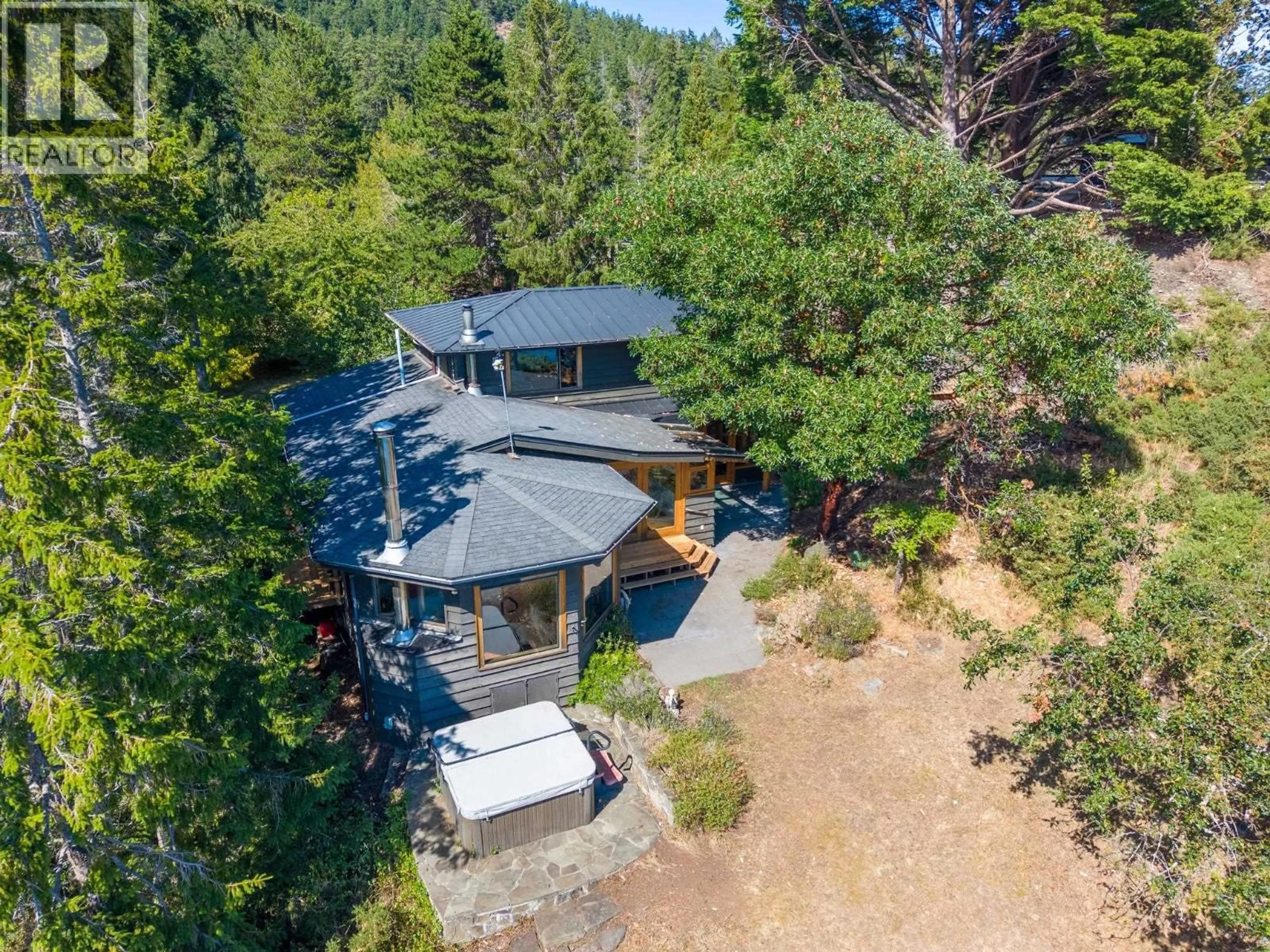A pic from outside/outdoor area/front of a property/back of a property/a pic from drone, forest/trees view for 9919 SOUTHLANDS DRIVE, Pender Island British Columbia V0N2M3