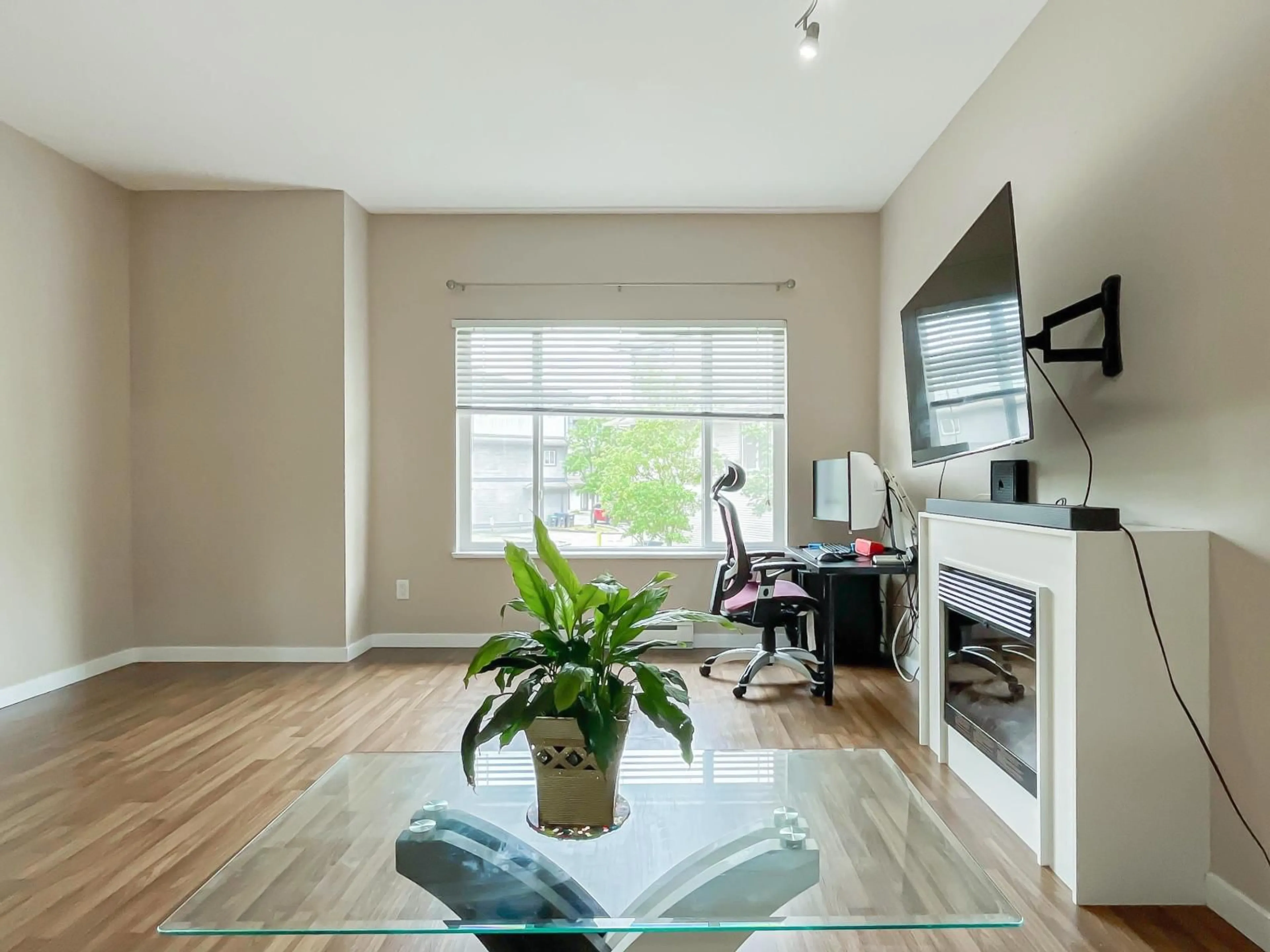 Living room with furniture, wood/laminate floor for 191 - 18701 66 AVENUE, Surrey British Columbia V3S4P3