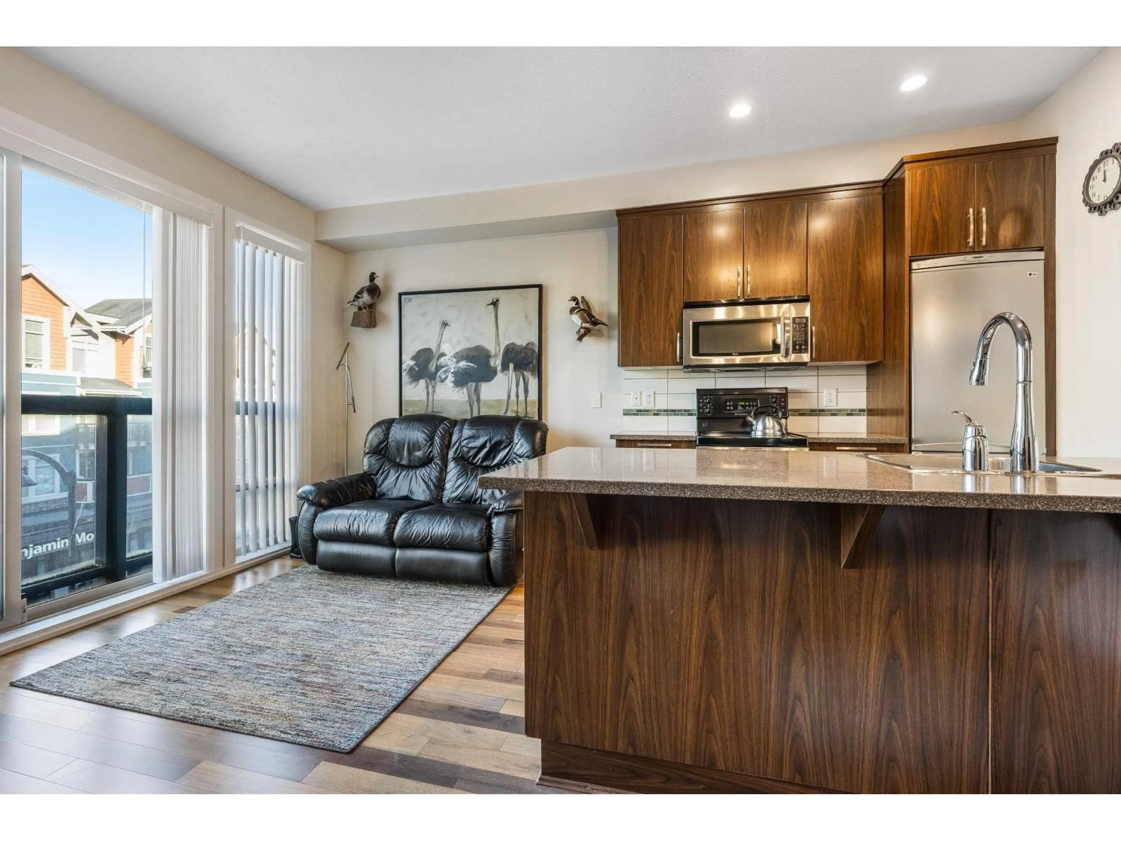 Open concept kitchen, wood/laminate floor for 312 - 45530 MARKET WAY, Chilliwack British Columbia V2R0M5