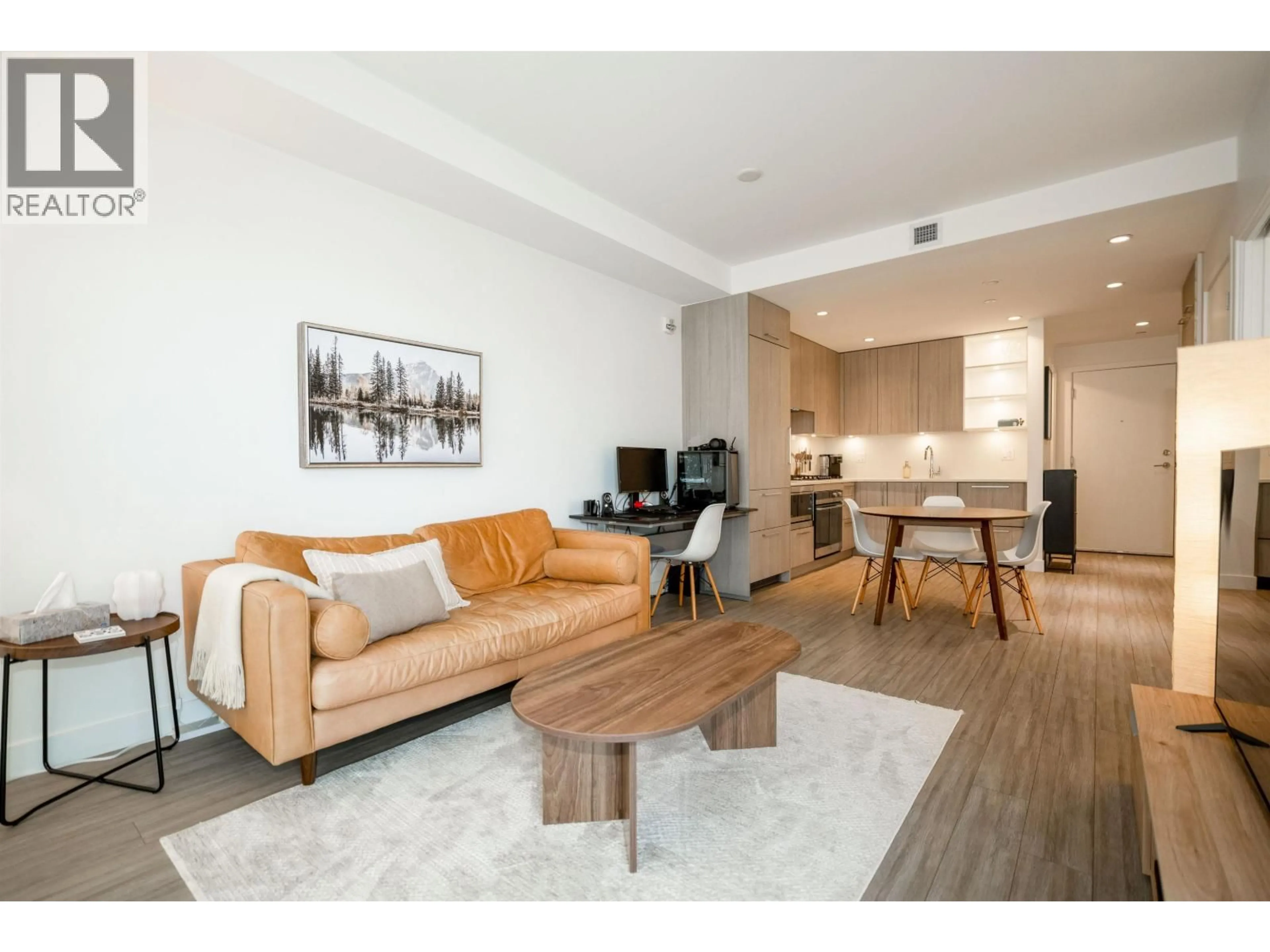 Living room with furniture, wood/laminate floor for 214 - 707 3RD STREET EAST, North Vancouver British Columbia V7L1G8