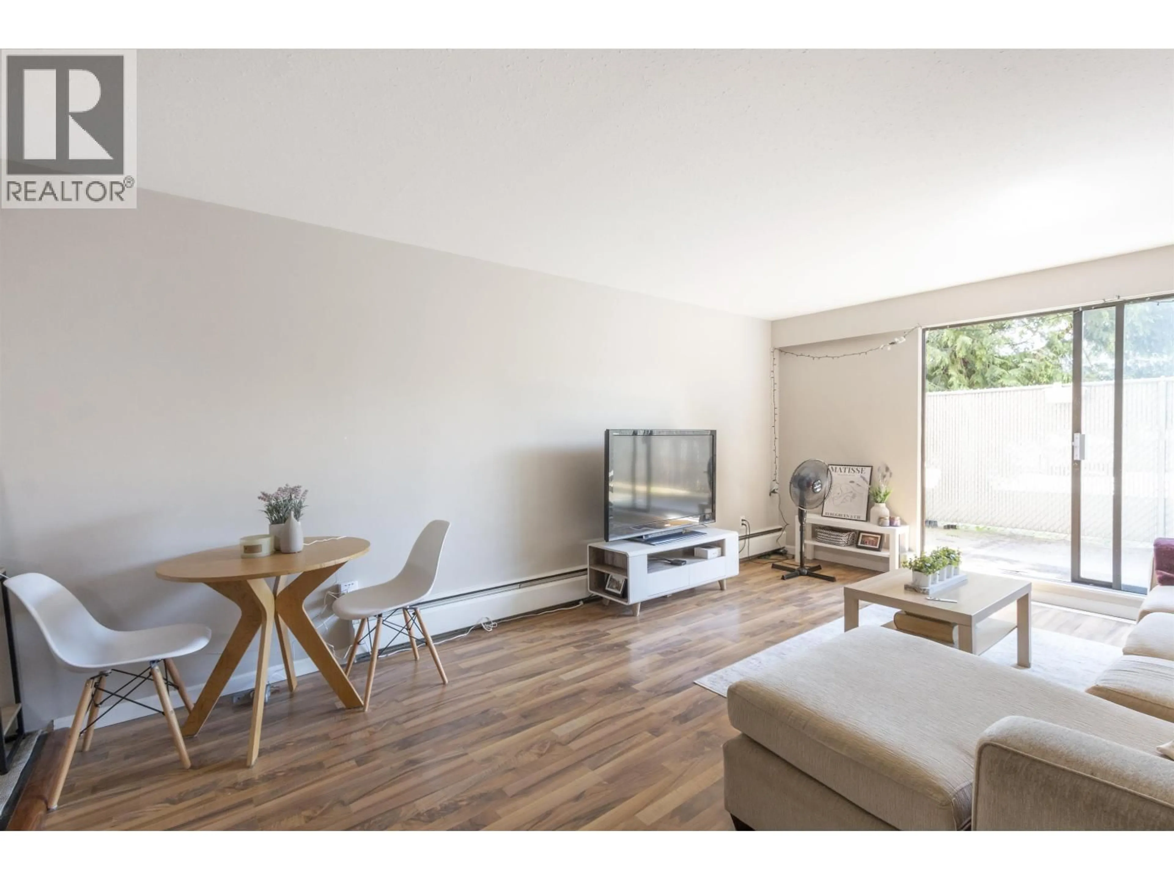 Living room with furniture, wood/laminate floor for 107 - 1000 KING ALBERT AVENUE, Coquitlam British Columbia V3J7A3