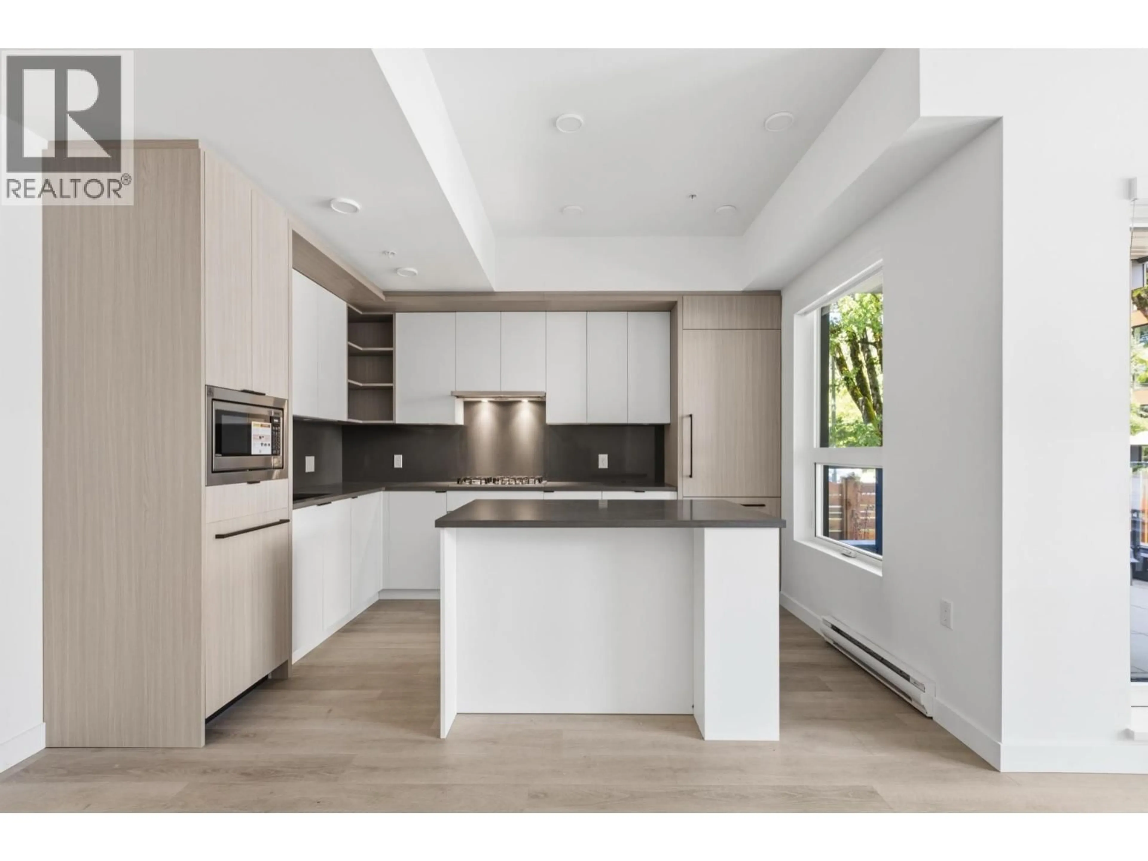 Open concept kitchen, unknown for 102 - 2268 BROADWAY, Vancouver British Columbia V5N0L2