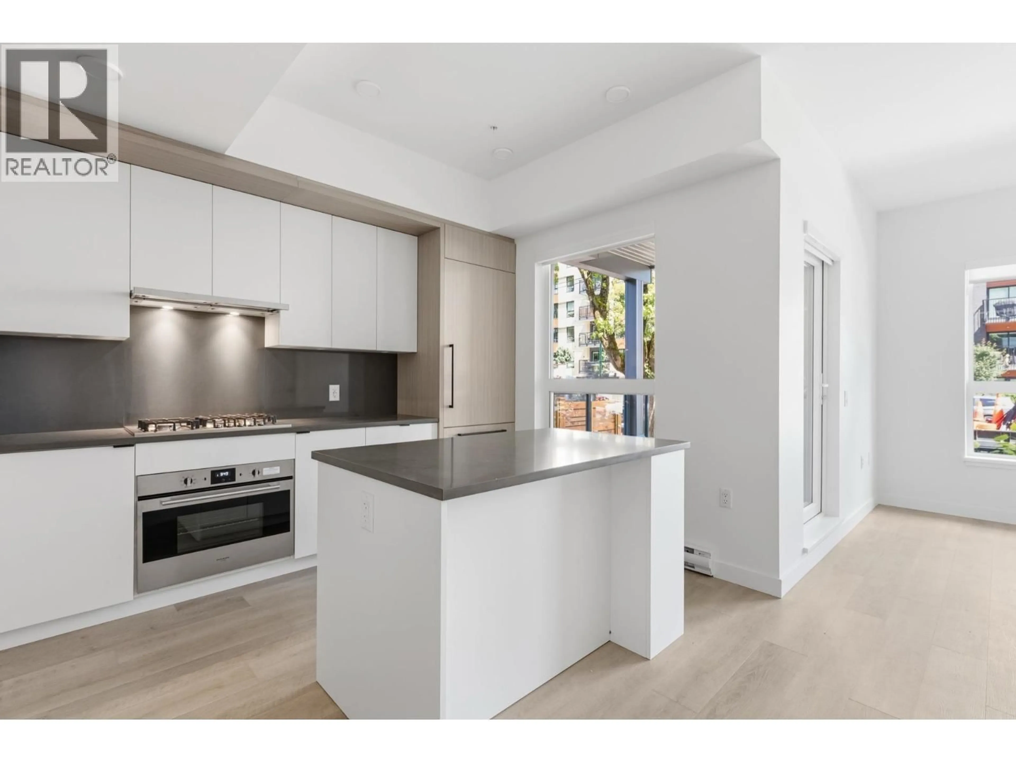 Open concept kitchen, unknown for 102 - 2268 BROADWAY, Vancouver British Columbia V5N0L2