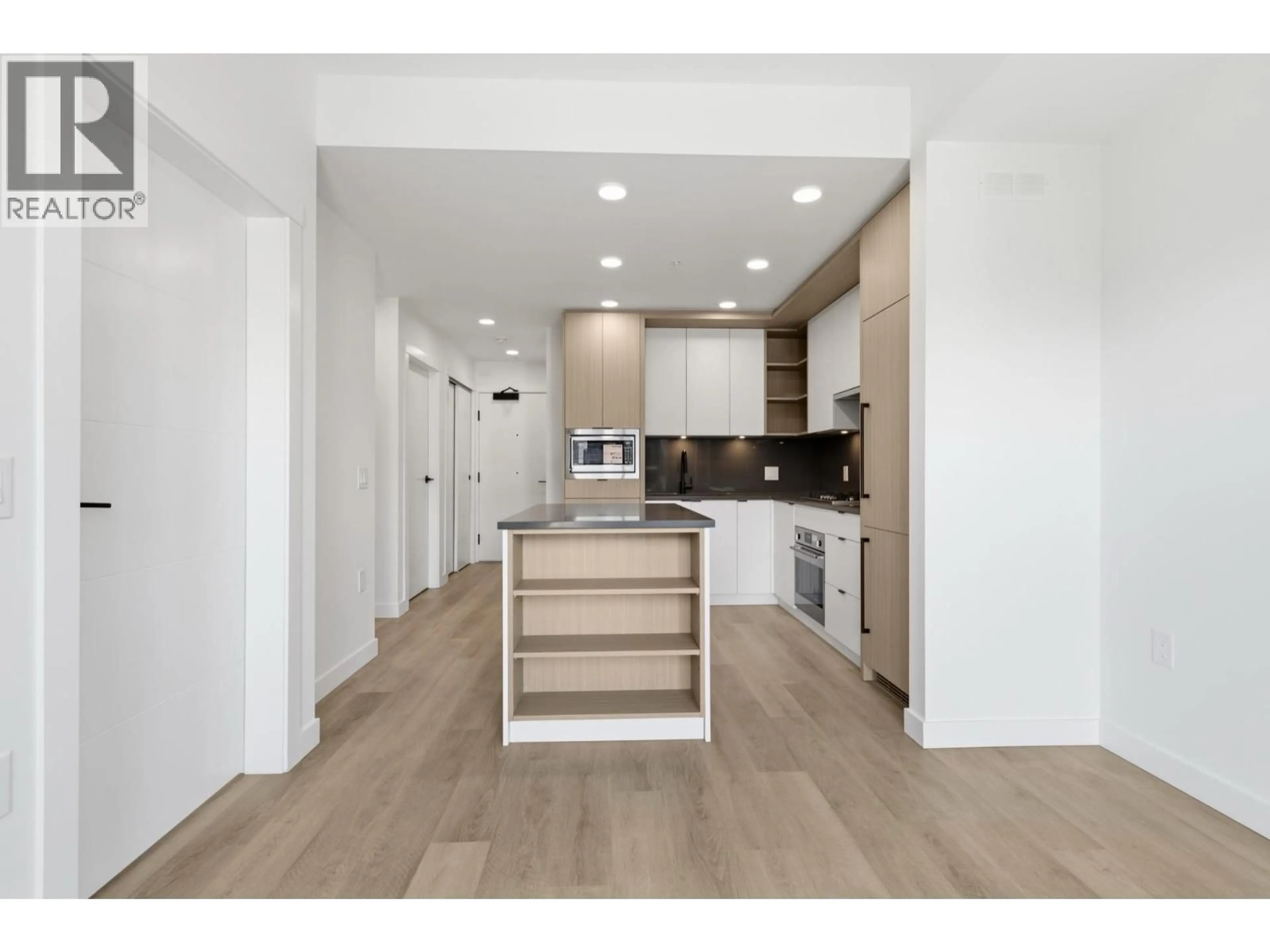 Open concept kitchen, wood/laminate floor for 404 - 2268 BROADWAY, Vancouver British Columbia V5N0L2
