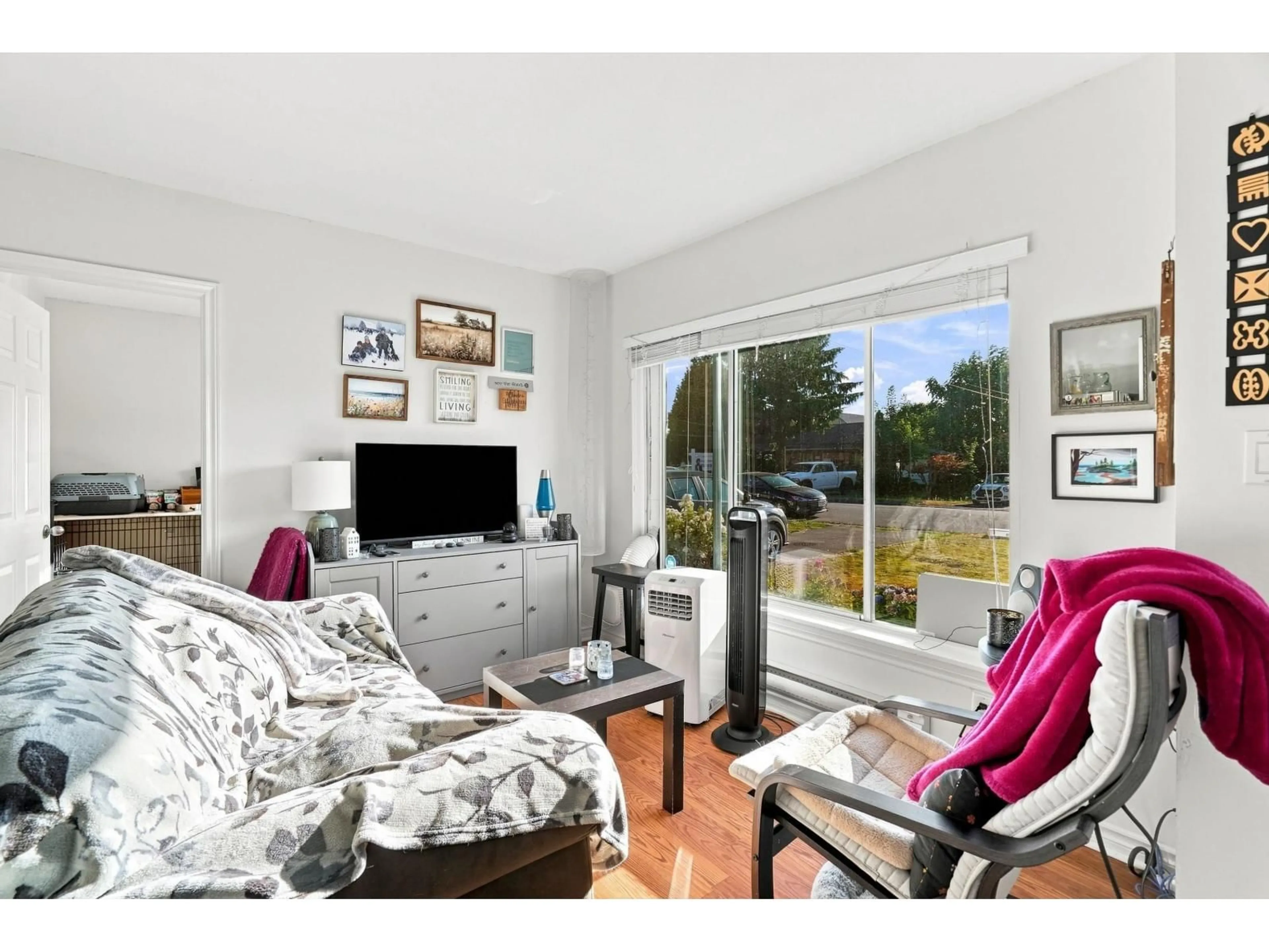 Living room with furniture, wood/laminate floor for 9458 MENZIES STREET, Chilliwack British Columbia V2P5Z4