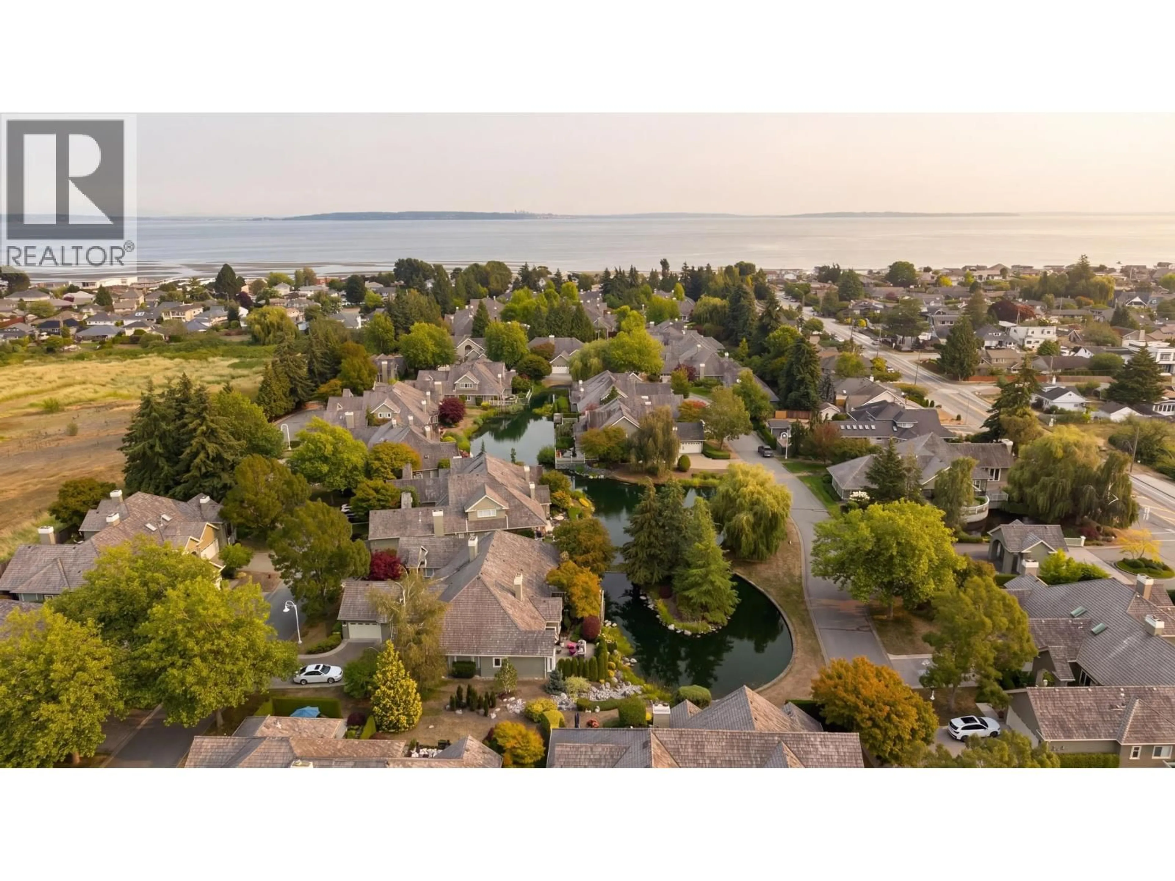 A pic from outside/outdoor area/front of a property/back of a property/a pic from drone, water/lake/river/ocean view for 327 - 6505 3 AVENUE, Tsawwassen British Columbia V4L2N1