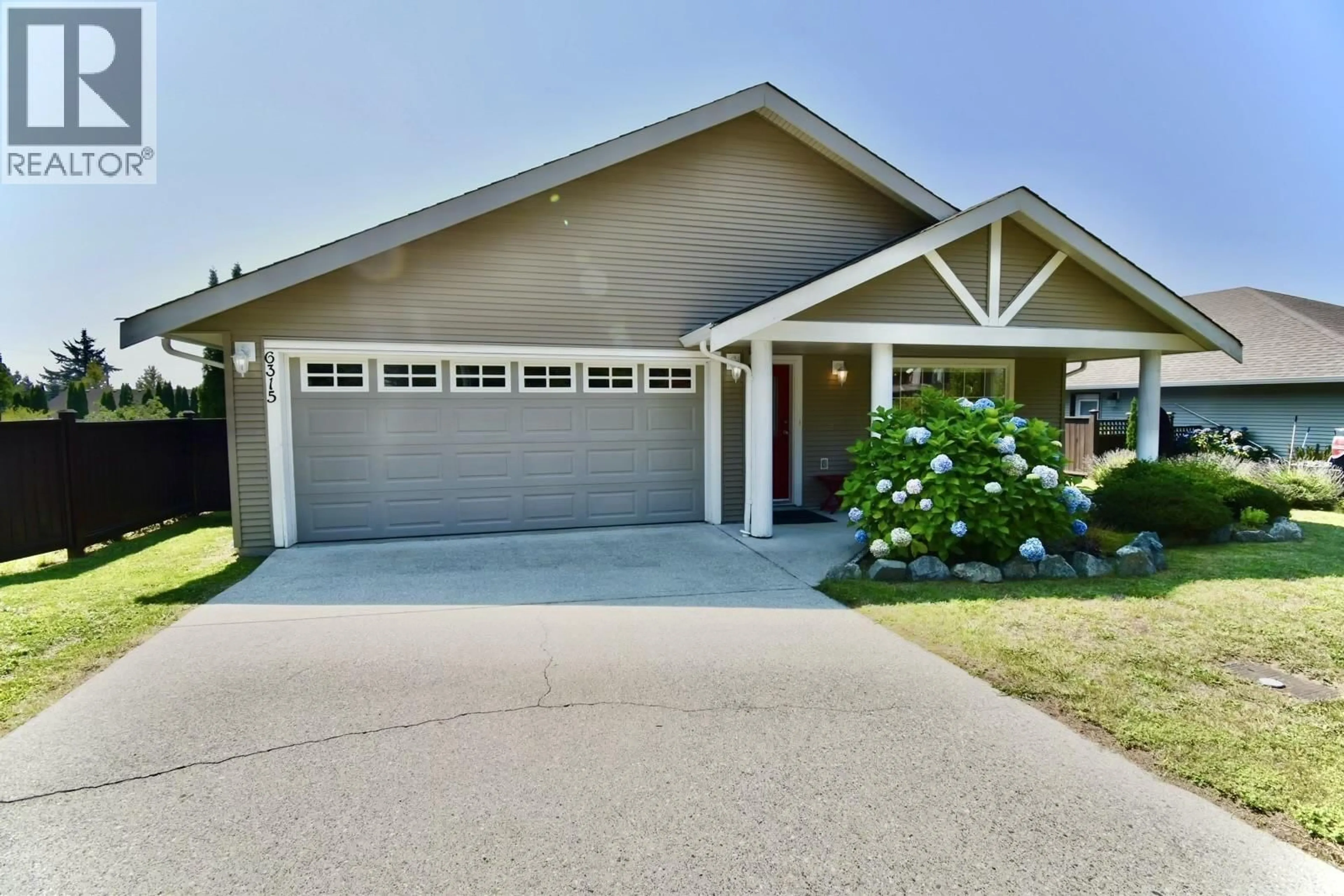Home with vinyl exterior material, street for 6315 TOWER ROAD, Sechelt British Columbia V7Z0T7