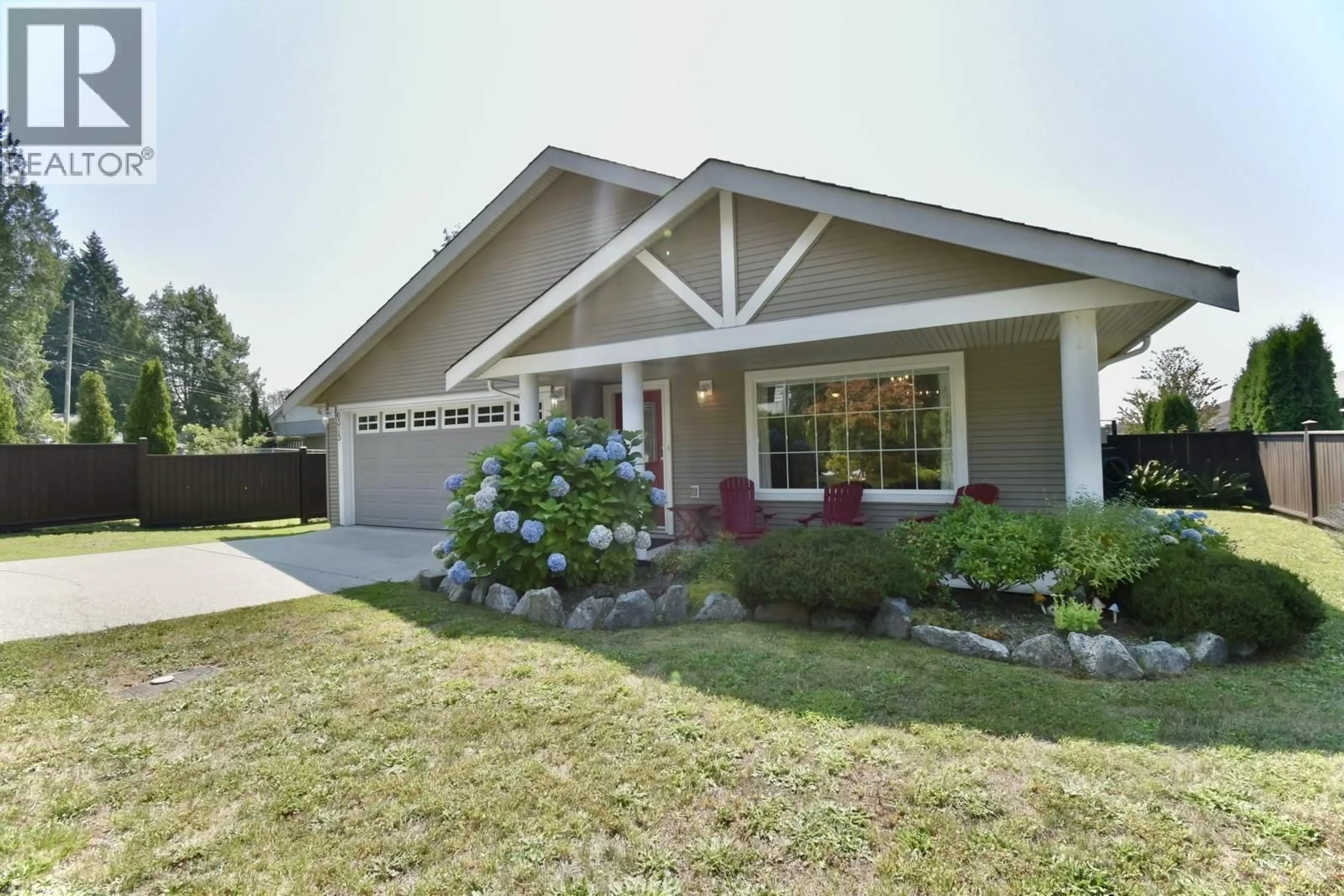 Home with vinyl exterior material, street for 6315 TOWER ROAD, Sechelt British Columbia V7Z0T7