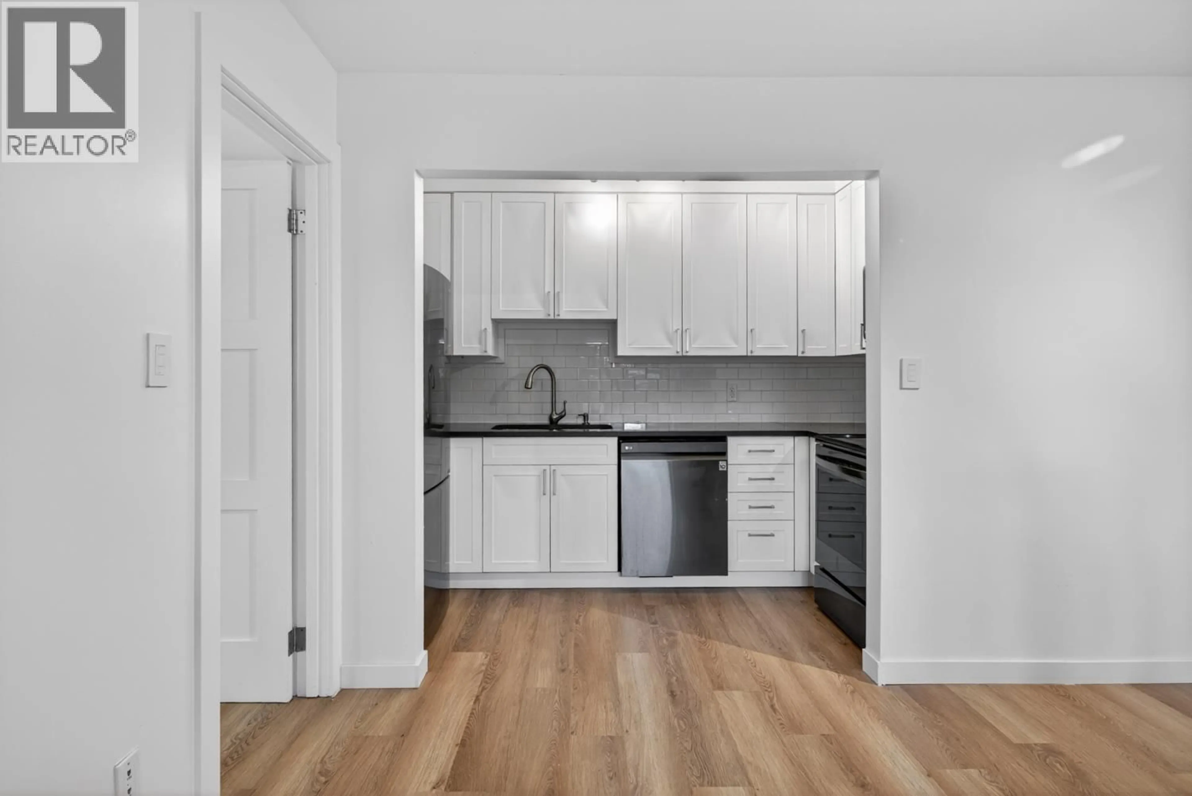 Standard kitchen, wood/laminate floor for 101 - 8645 OSLER STREET, Vancouver British Columbia V6P4E6