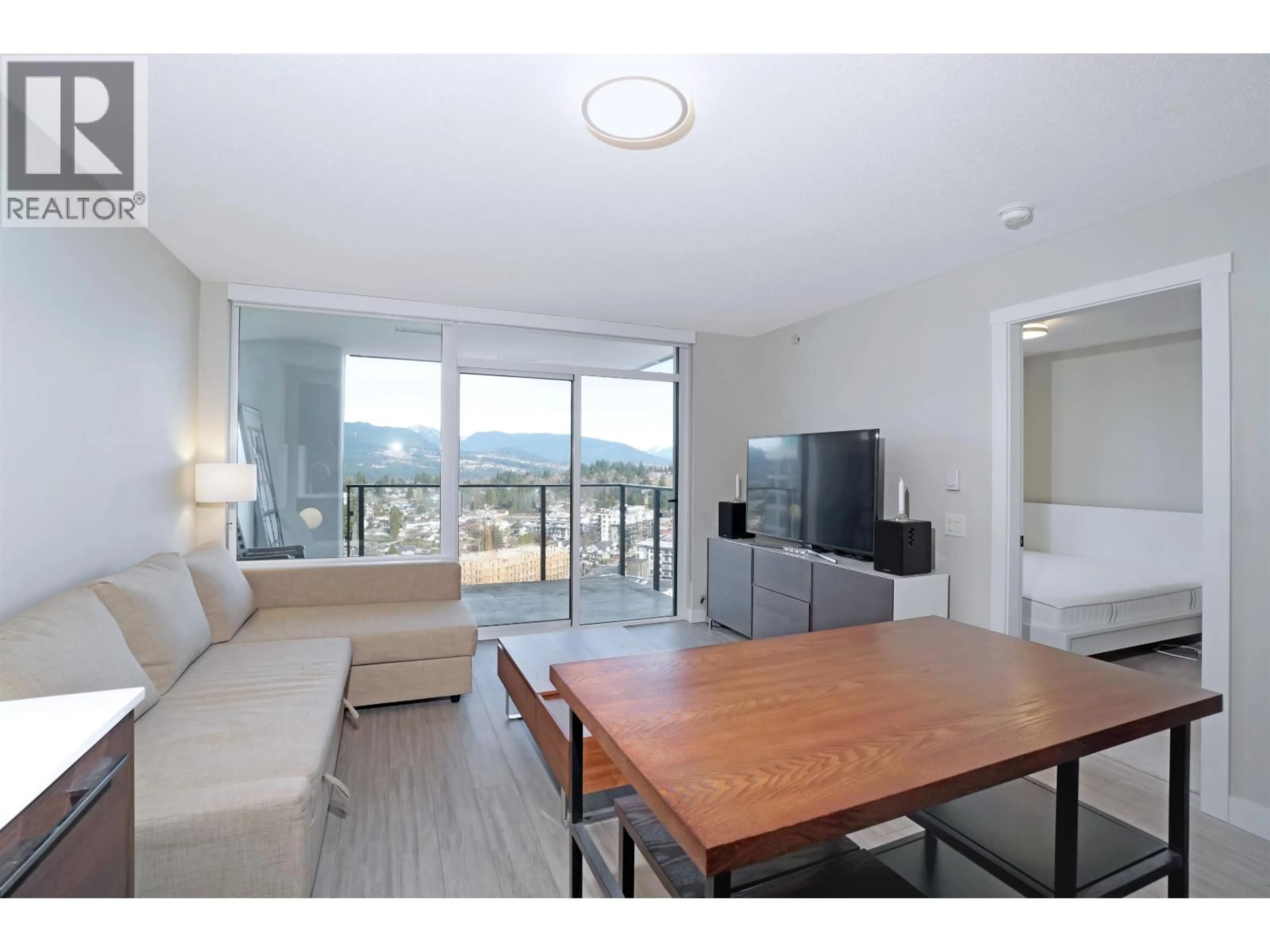 Living room with furniture, wood/laminate floor for 2606 - 570 EMERSON STREET, Coquitlam British Columbia V3J0G3