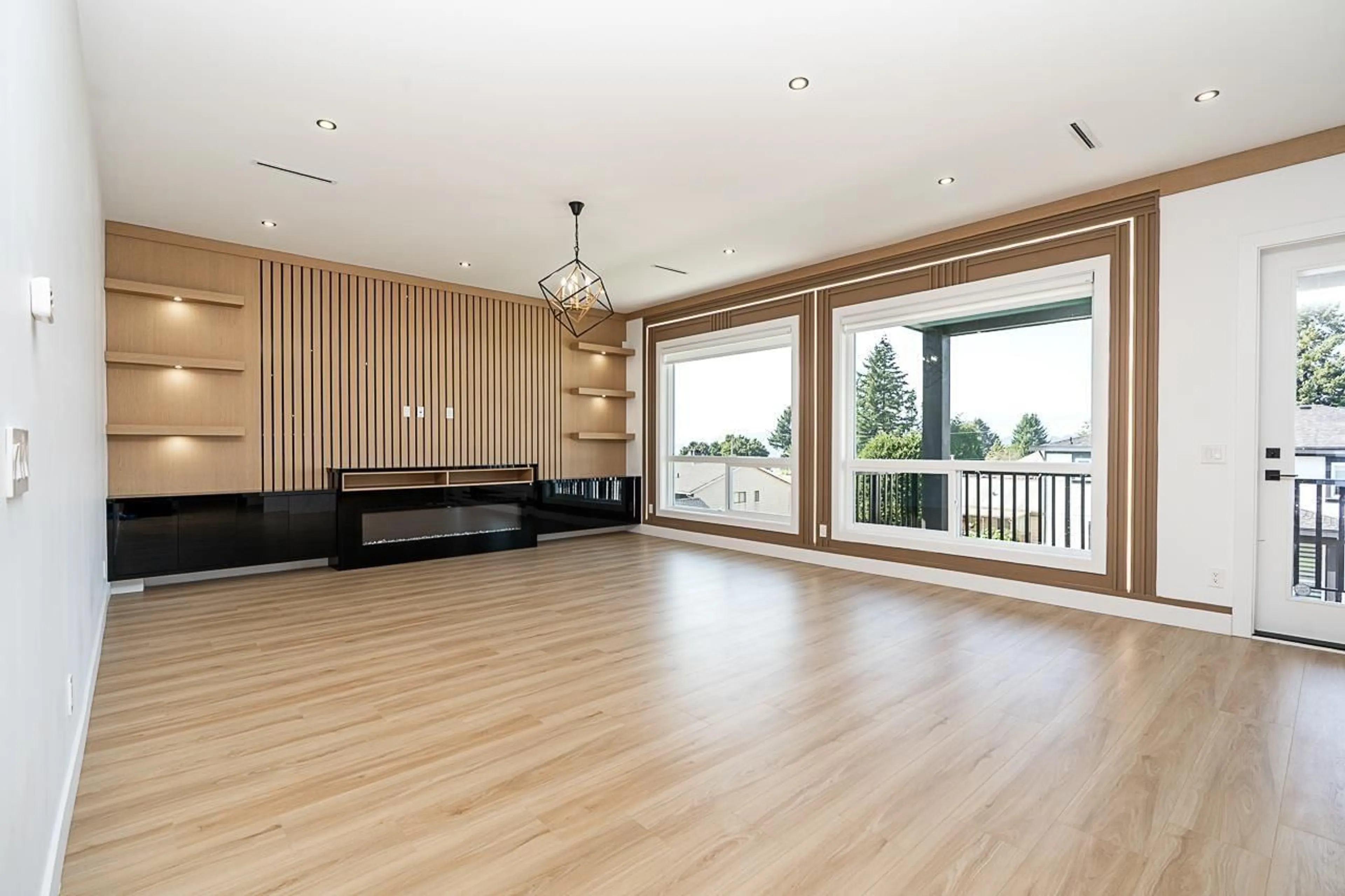 Living room with furniture, wood/laminate floor for 13979 113 AVENUE, Surrey British Columbia V3R2K2