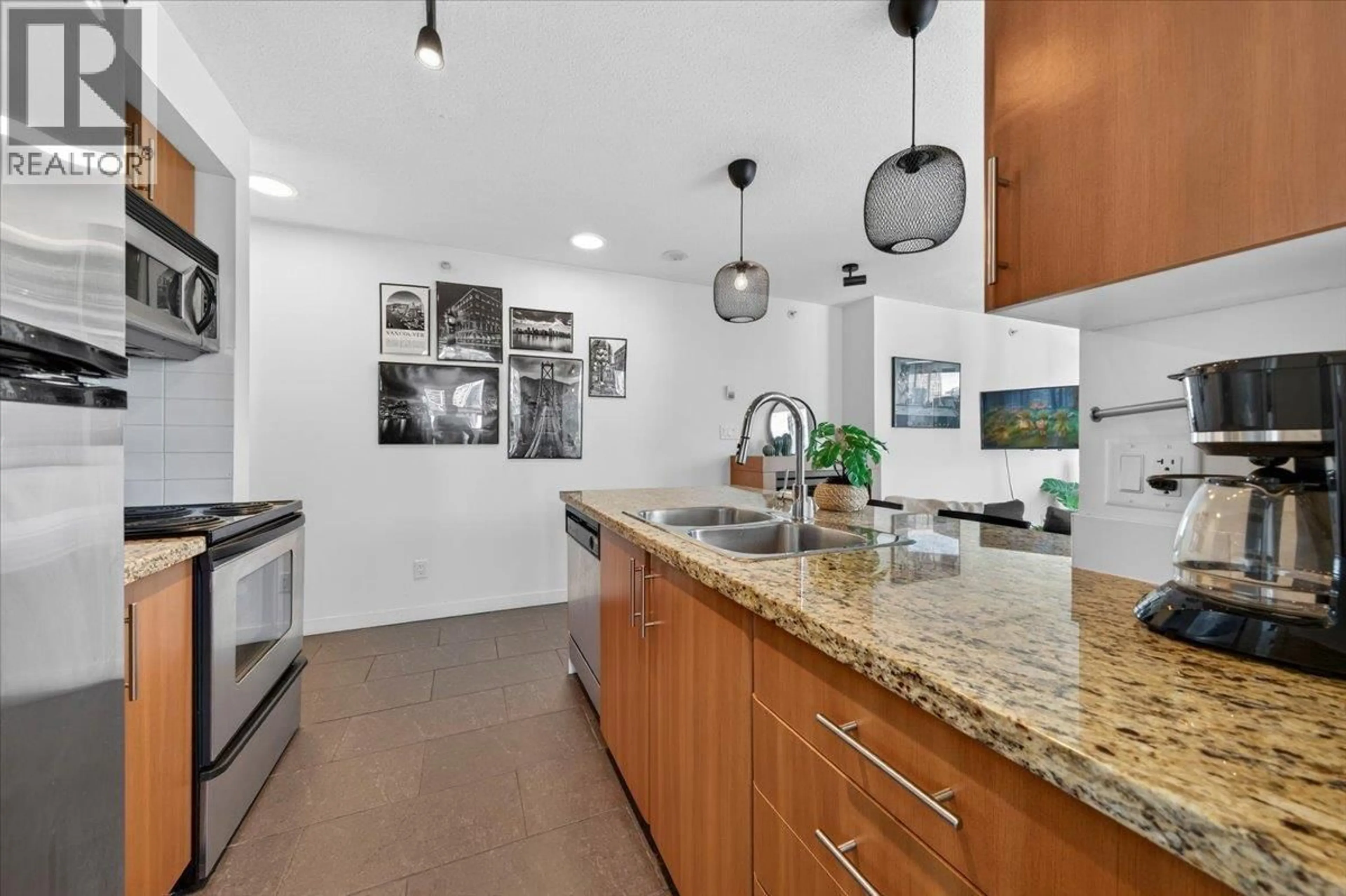 Open concept kitchen, ceramic/tile floor for 905 - 58 KEEFER PLACE, Vancouver British Columbia V6B0B8