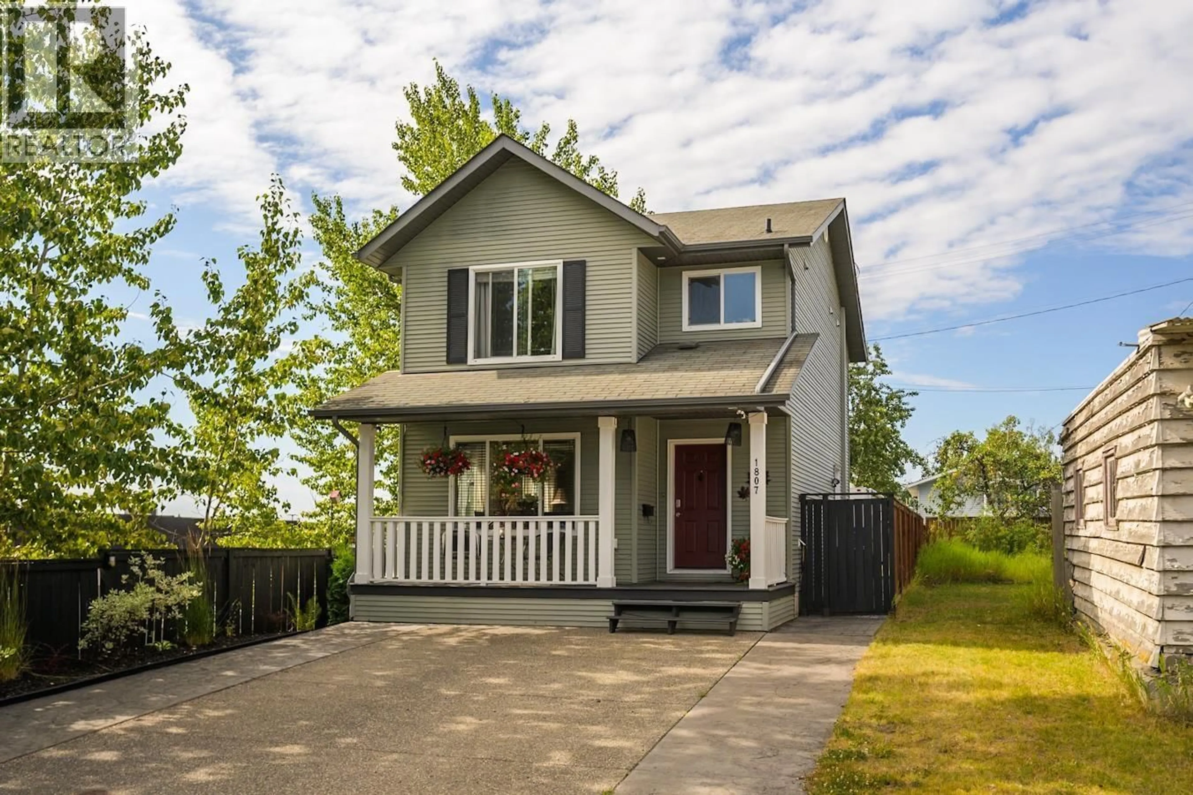 Home with vinyl exterior material, street for 1807 12TH AVENUE, Prince George British Columbia V2M1P8