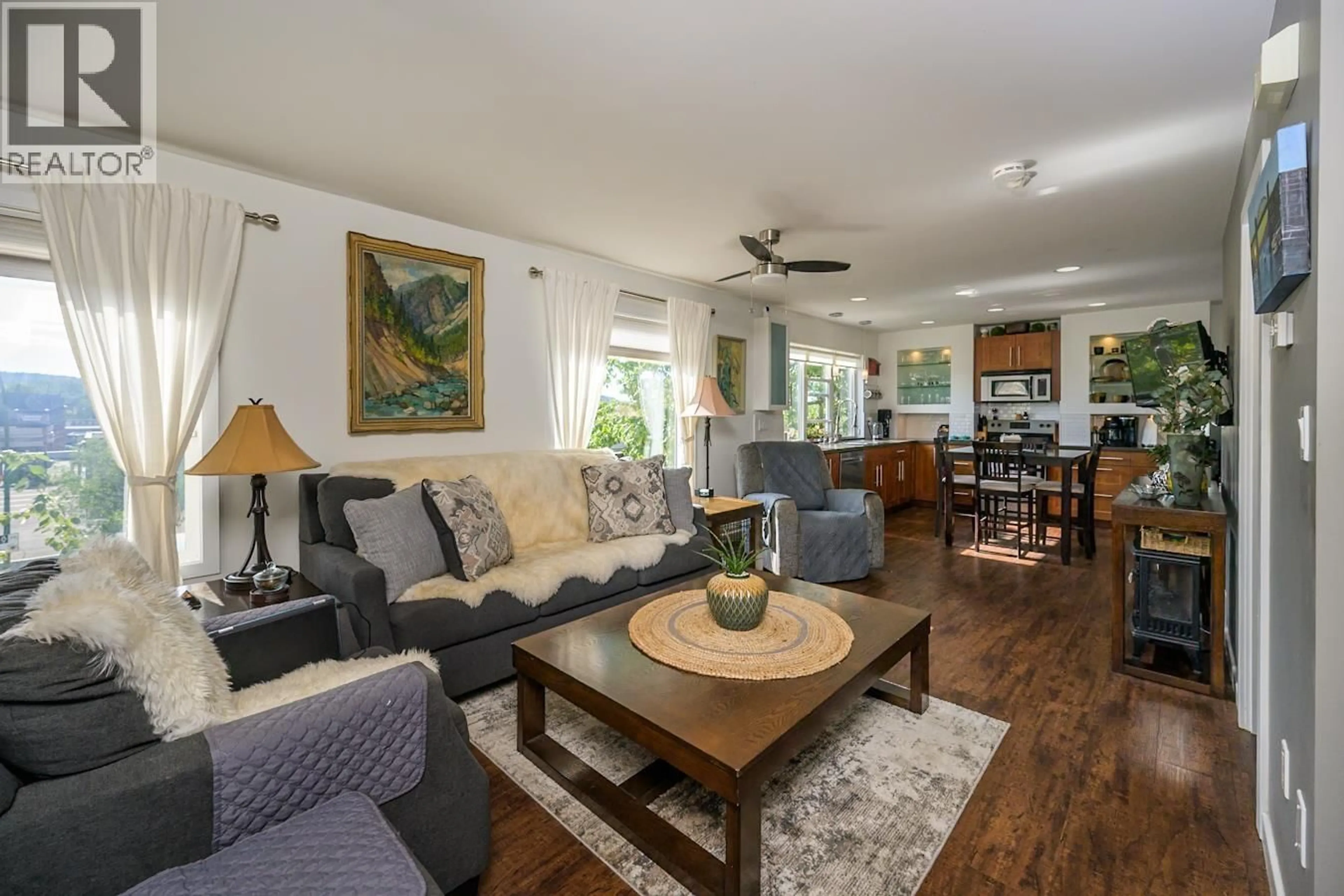 Living room with furniture, wood/laminate floor for 1807 12TH AVENUE, Prince George British Columbia V2M1P8