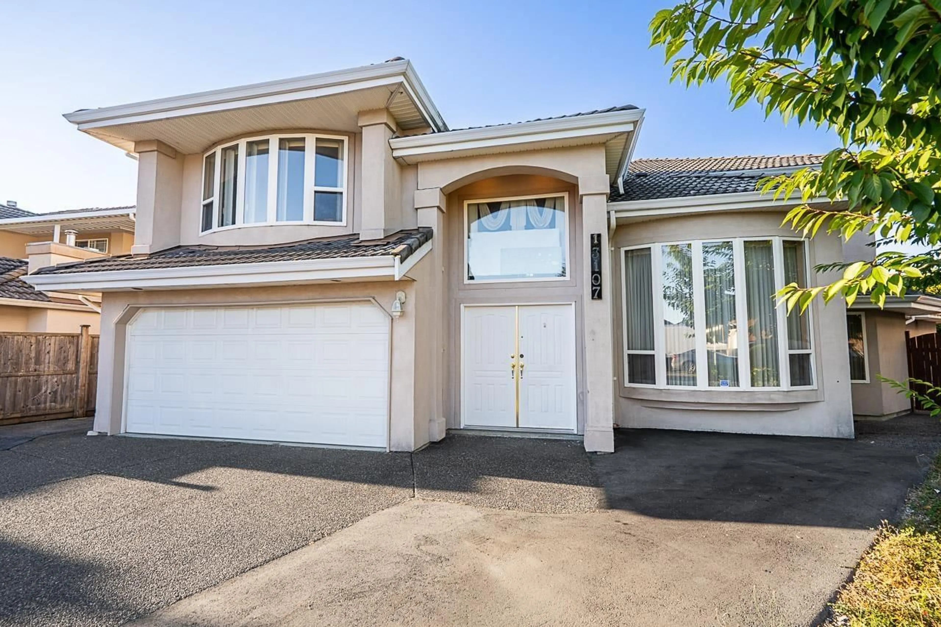 Home with vinyl exterior material, street for 13107 74 AVENUE, Surrey British Columbia V3W1C3