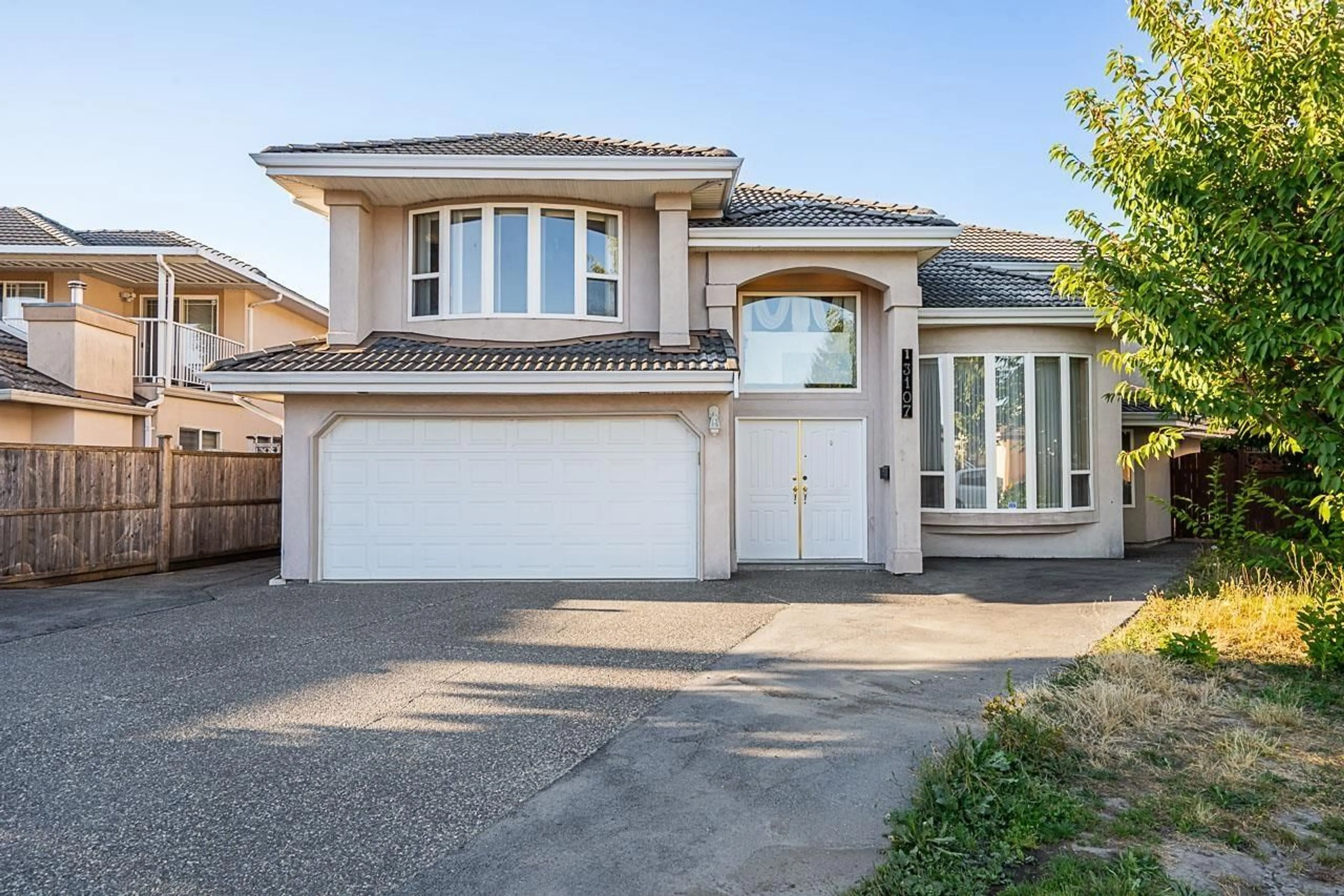 Home with vinyl exterior material, street for 13107 74 AVENUE, Surrey British Columbia V3W1C3