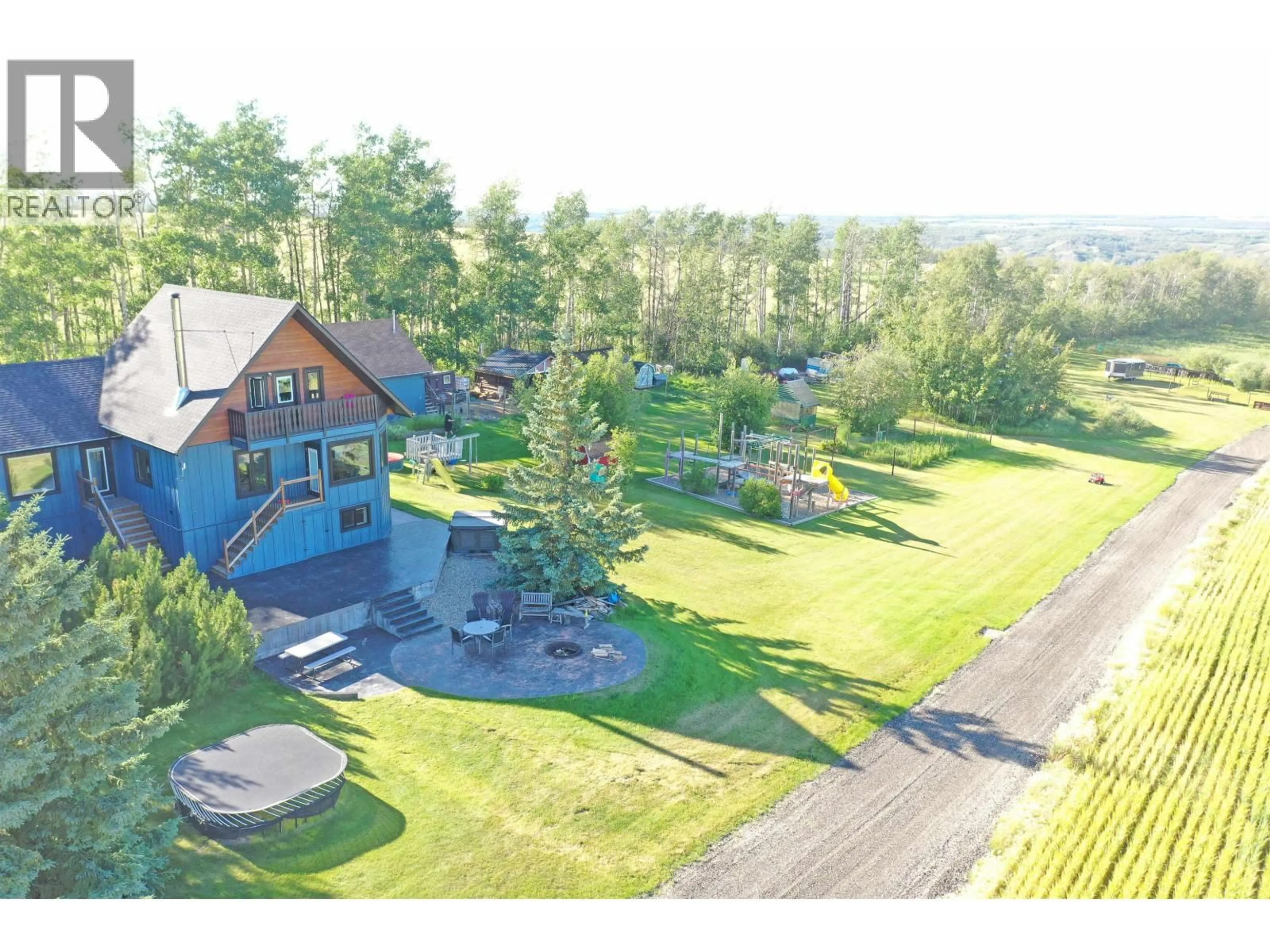 A pic from outside/outdoor area/front of a property/back of a property/a pic from drone, mountain view for 5294 242 ROAD, Fort St. John British Columbia V0C1C0