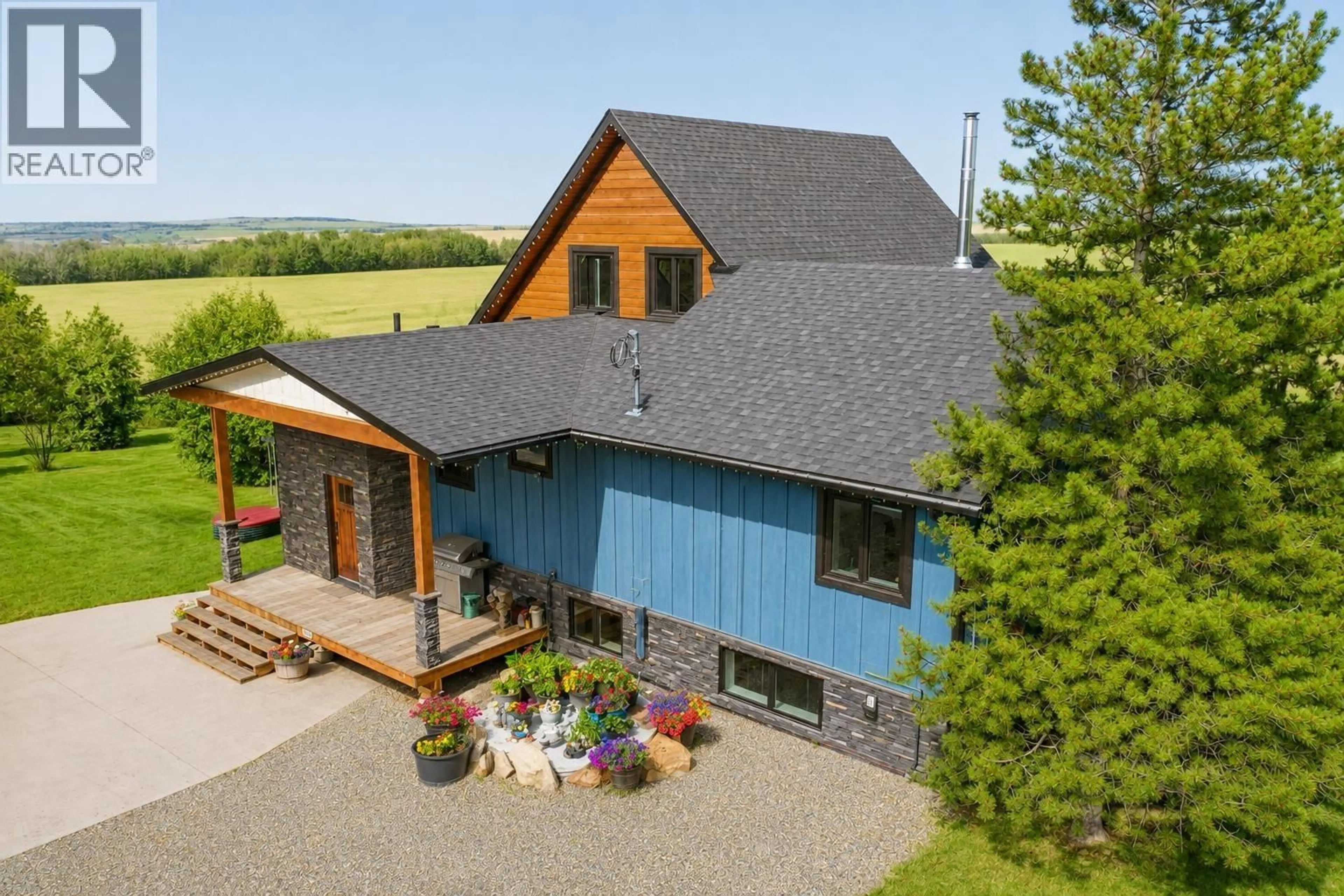A pic from outside/outdoor area/front of a property/back of a property/a pic from drone, unknown for 5294 242 ROAD, Fort St. John British Columbia V0C1C0