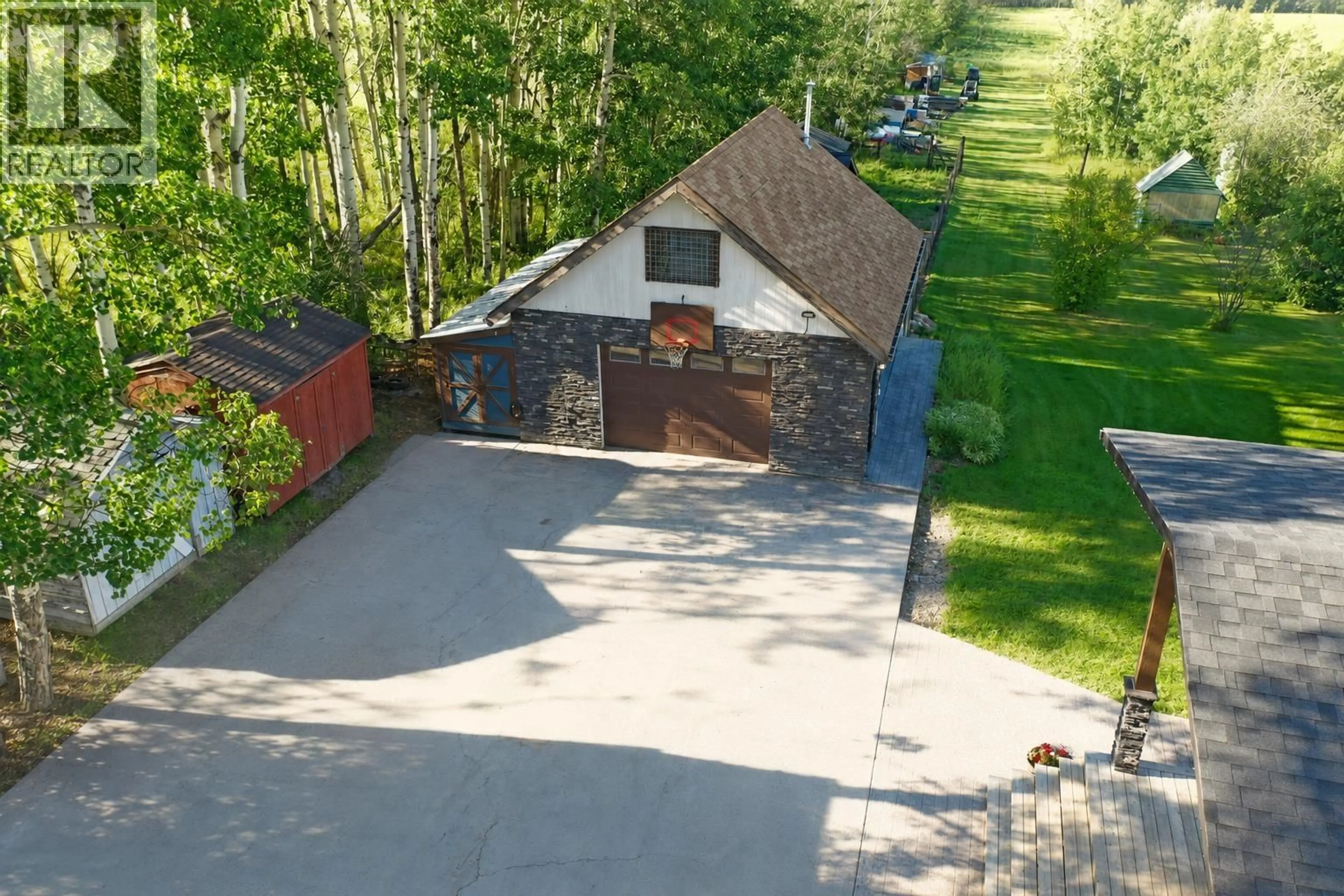 A pic from outside/outdoor area/front of a property/back of a property/a pic from drone, street for 5294 242 ROAD, Fort St. John British Columbia V0C1C0