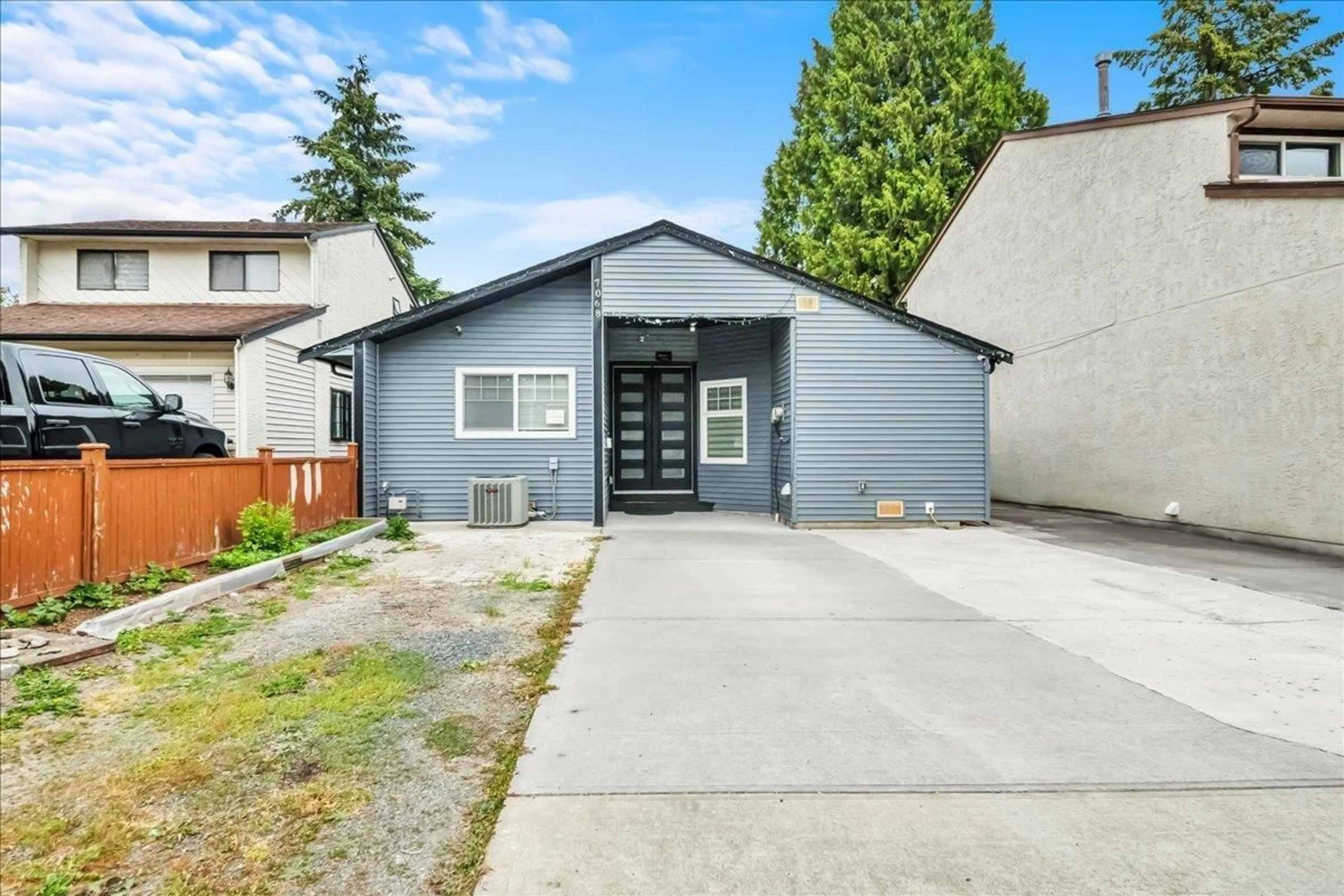 Home with vinyl exterior material, street for 7068 129A AVENUE, Surrey British Columbia V3W2V7