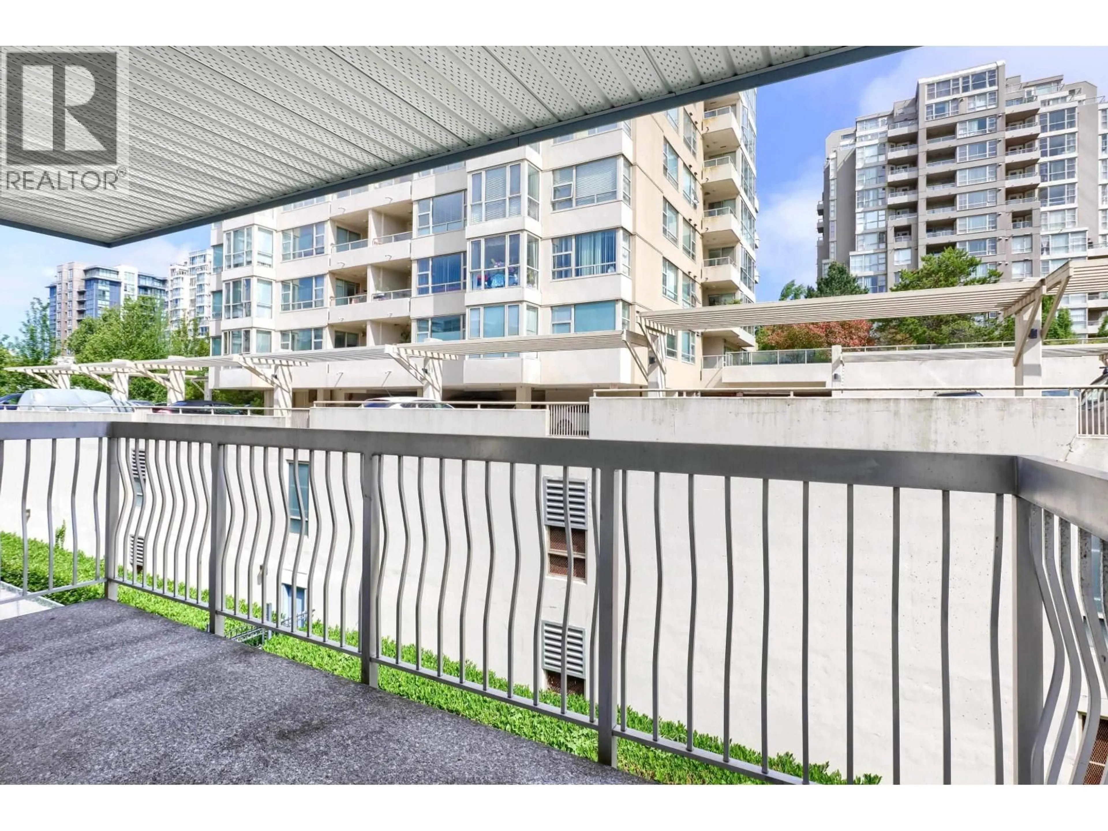 Balcony in the apartment, city buildings view from balcony for 208 - 6340 BUSWELL STREET, Richmond British Columbia V6Y2E9