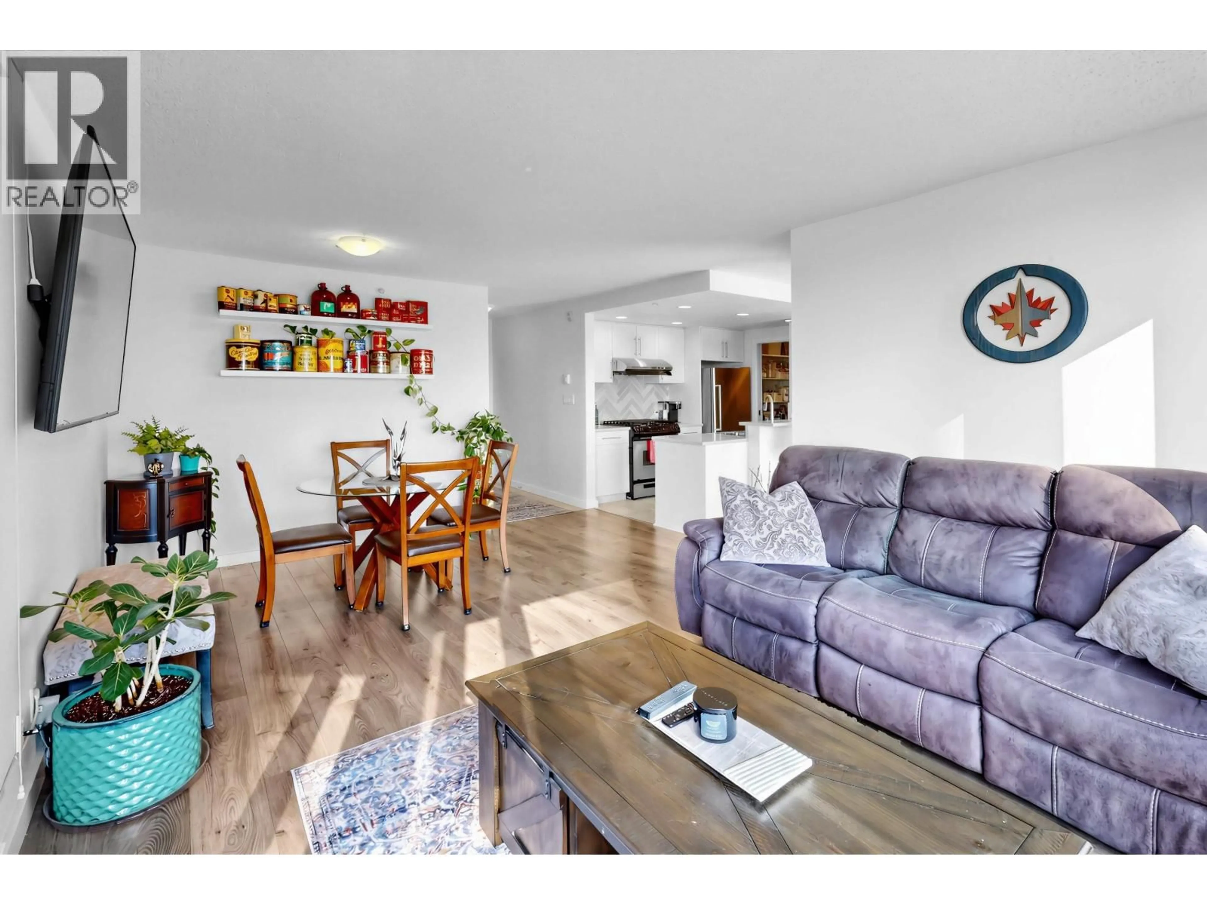 Living room with furniture, wood/laminate floor for 1501 - 455 BEACH CRESCENT, Vancouver British Columbia V6Z3E5