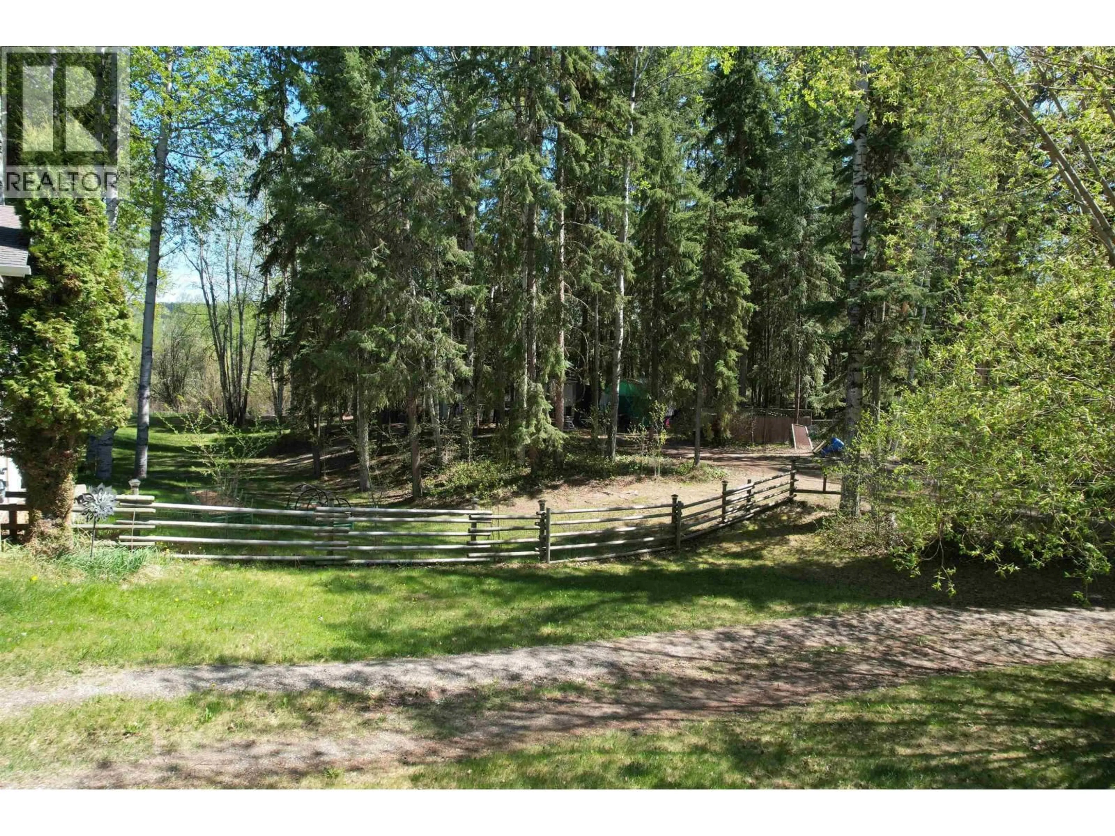A pic from outside/outdoor area/front of a property/back of a property/a pic from drone, forest/trees view for 144 ENEMARK ROAD, Quesnel British Columbia V2J4W6