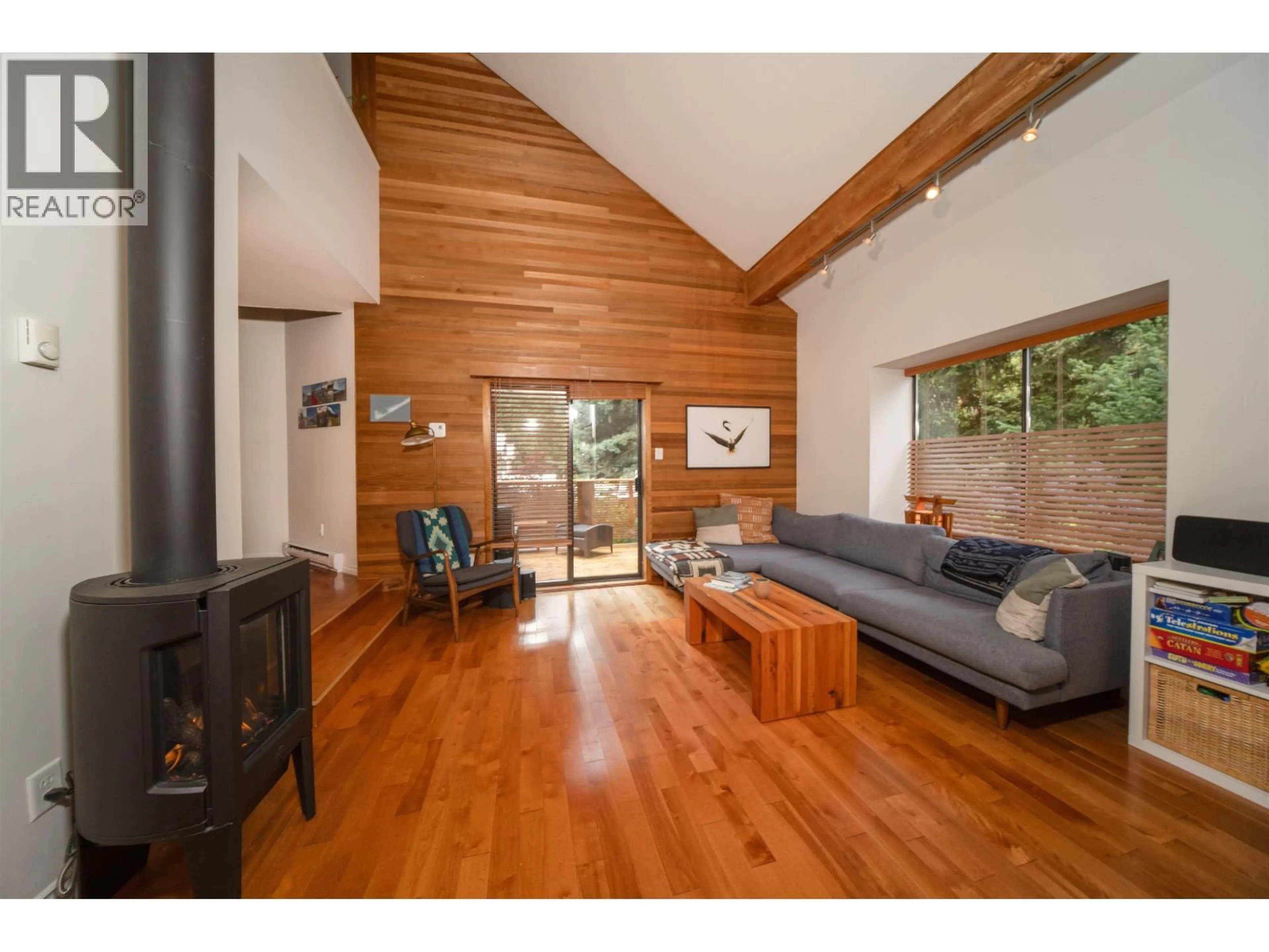 Living room with furniture, wood/laminate floor for 8133 CEDAR SPRINGS ROAD, Whistler British Columbia V8E0G2