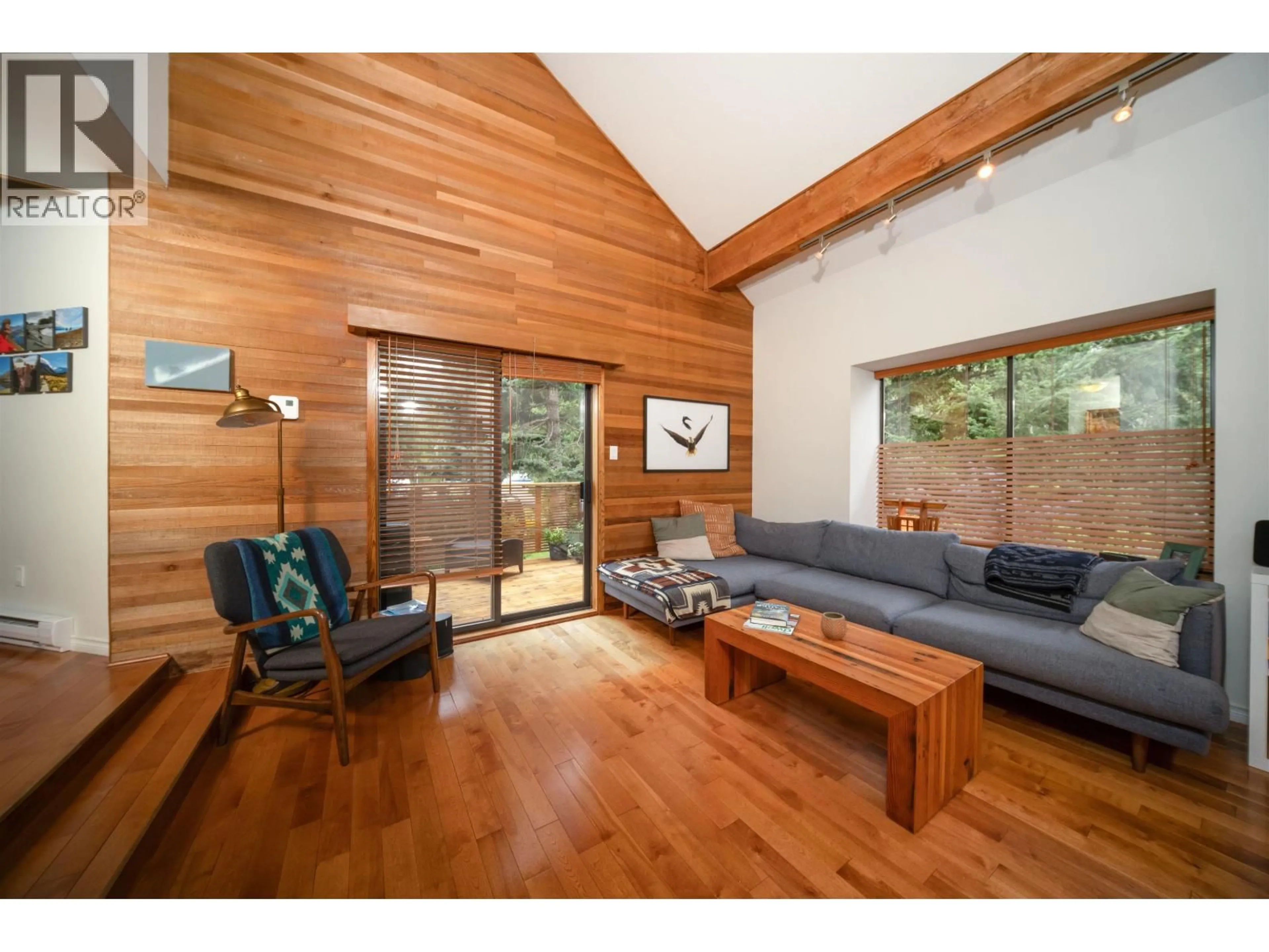 Living room with furniture, wood/laminate floor for 8133 CEDAR SPRINGS ROAD, Whistler British Columbia V8E0G2