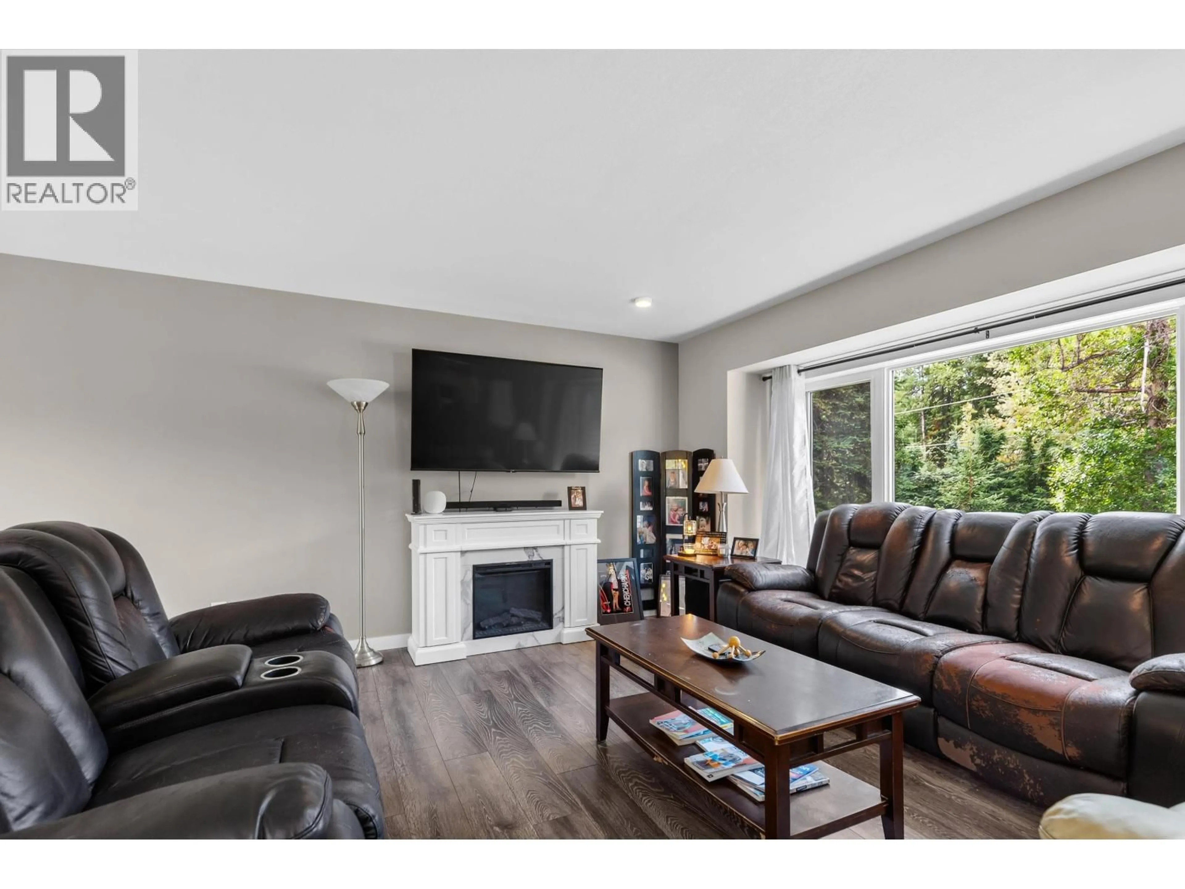 Living room with furniture, wood/laminate floor for 10246 JUTLAND ROAD, Prince George British Columbia V2N4Y8