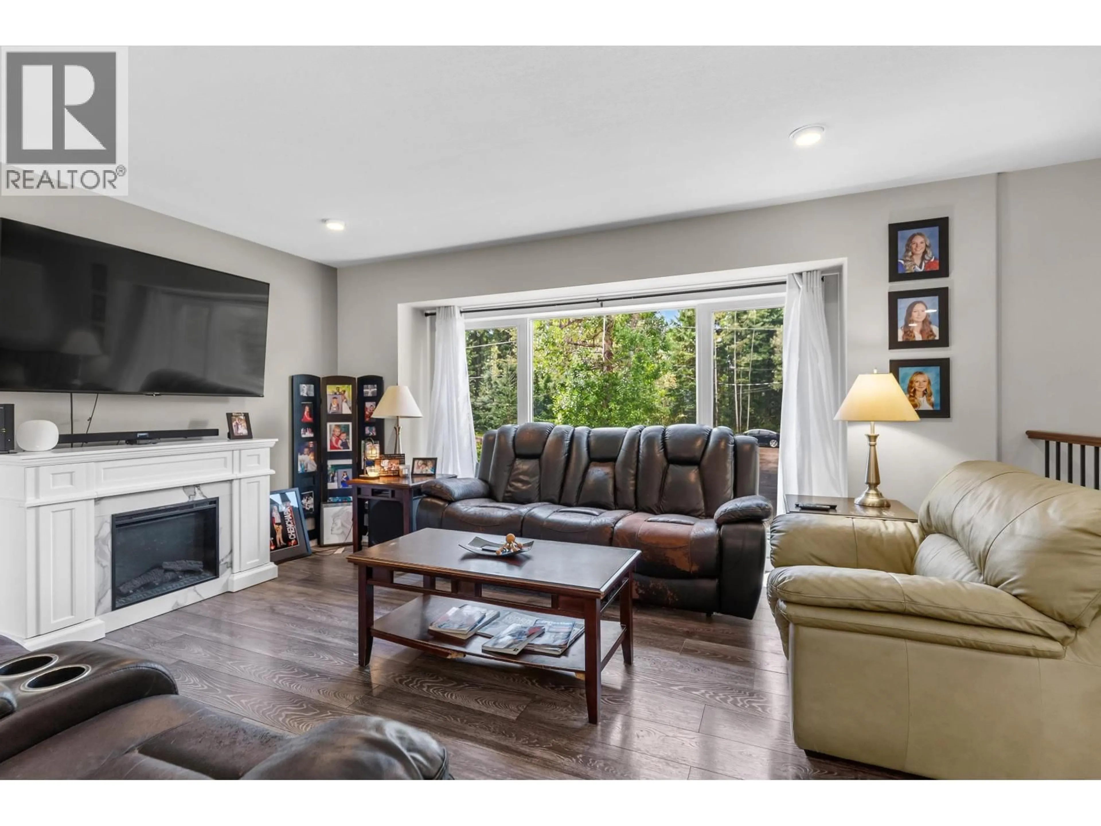 Living room with furniture, wood/laminate floor for 10246 JUTLAND ROAD, Prince George British Columbia V2N4Y8