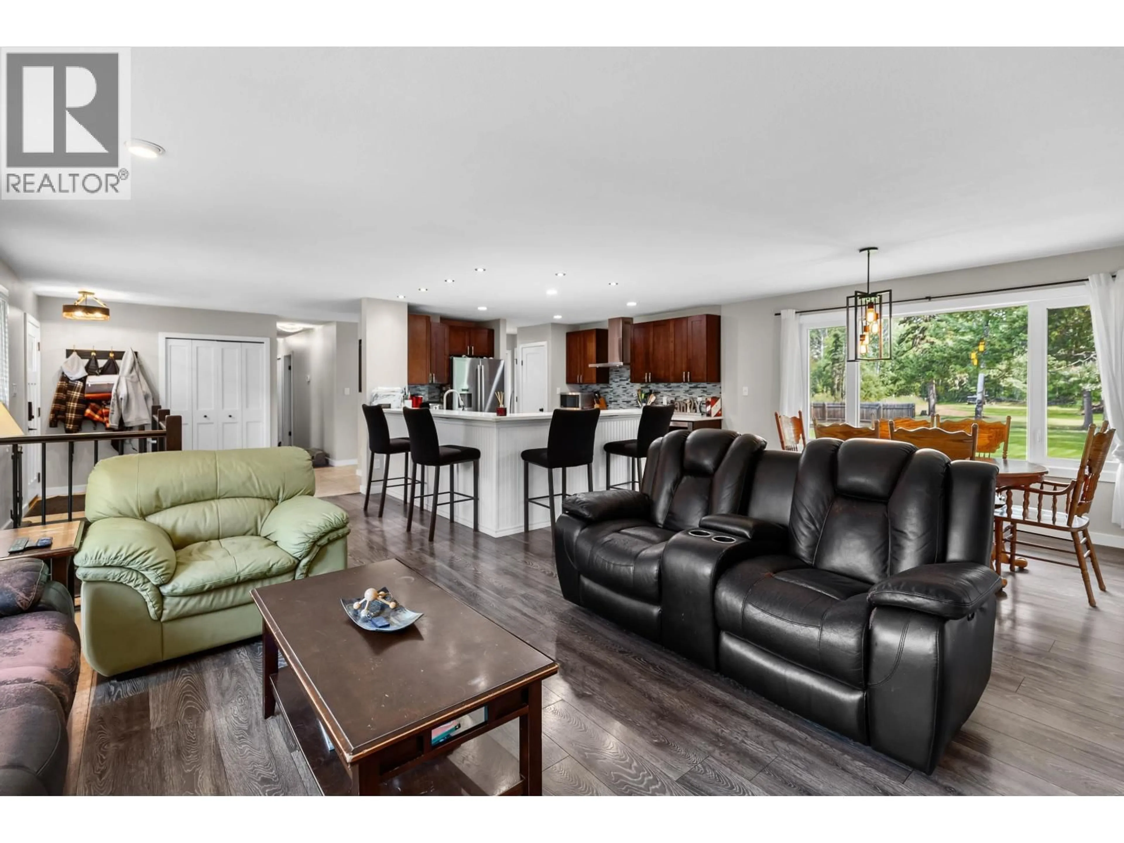 Living room with furniture, wood/laminate floor for 10246 JUTLAND ROAD, Prince George British Columbia V2N4Y8