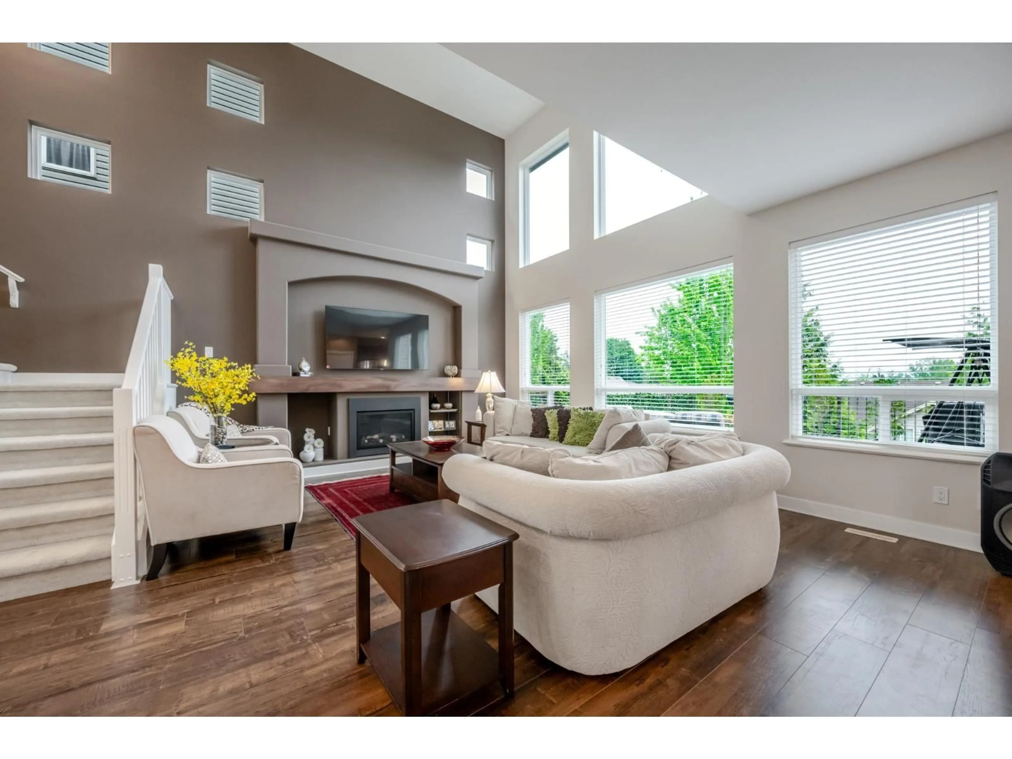 Living room with furniture, wood/laminate floor for 2338 CHARDONNAY LANE, Abbotsford British Columbia V4X0A6