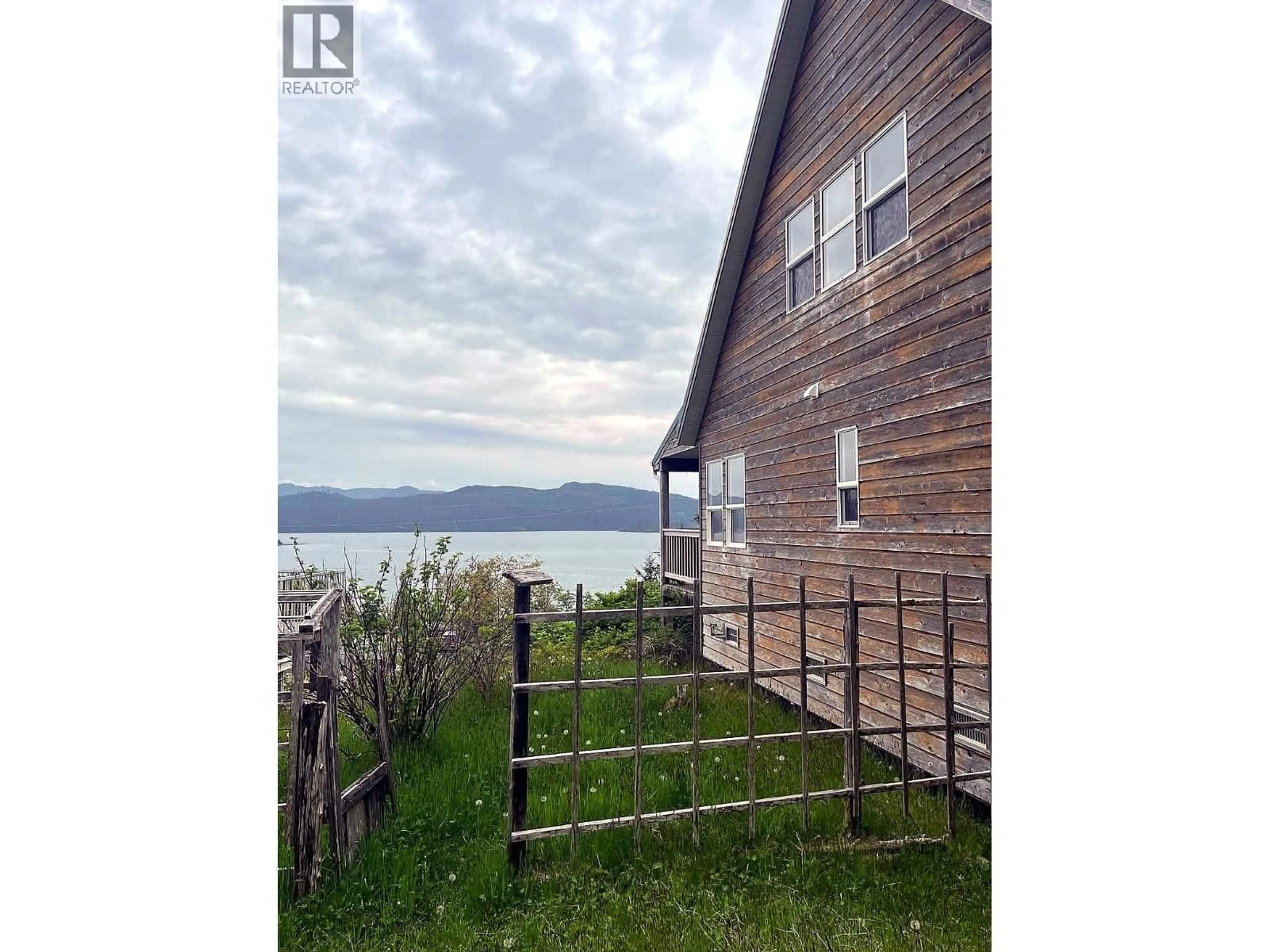 A pic from outside/outdoor area/front of a property/back of a property/a pic from drone, water/lake/river/ocean view for 209 2ND AVENUE, Daajing Giids City British Columbia V0T1S0