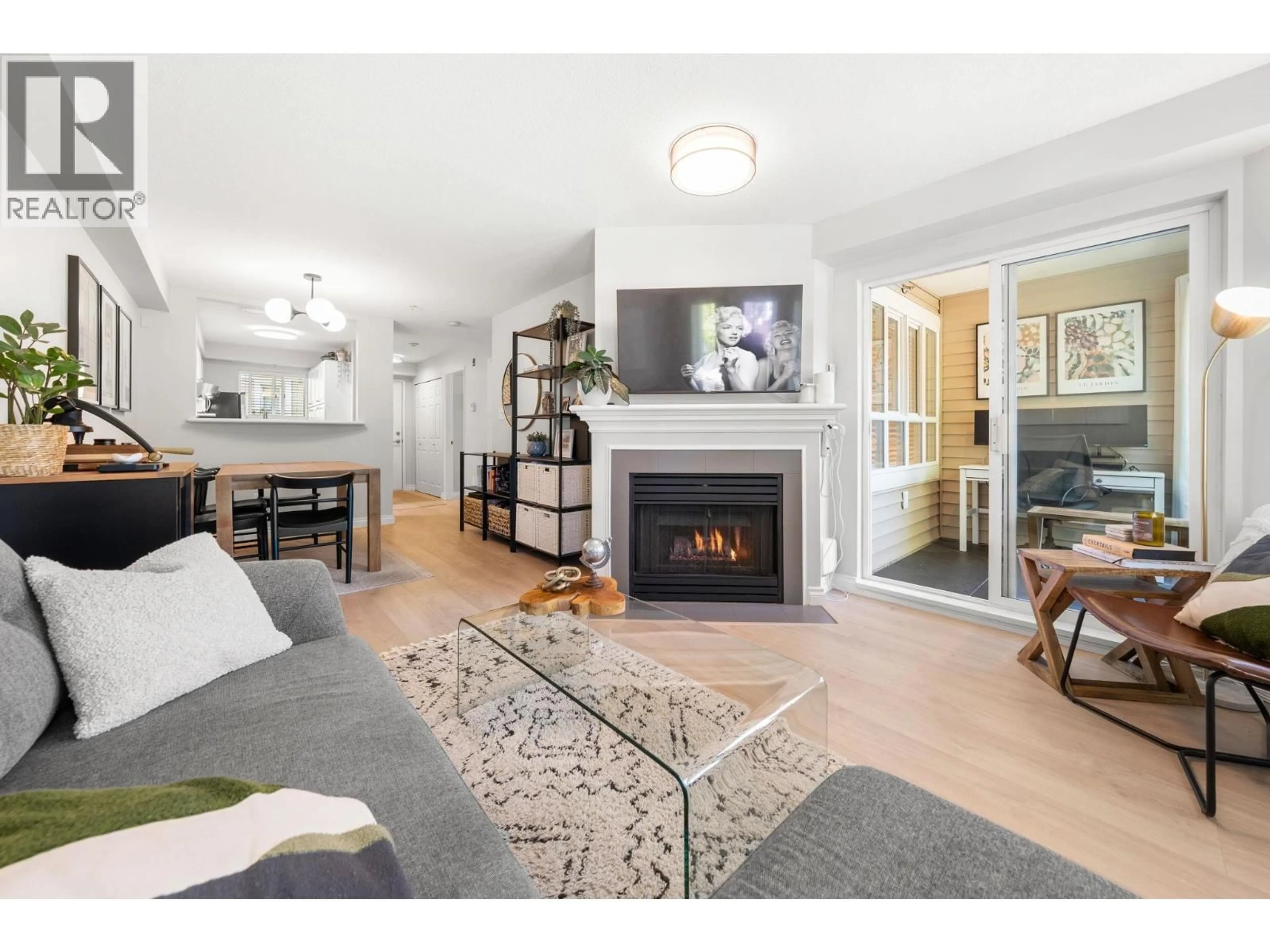 Living room with furniture, wood/laminate floor for 249 - 2565 BROADWAY, Vancouver British Columbia V6K2E9