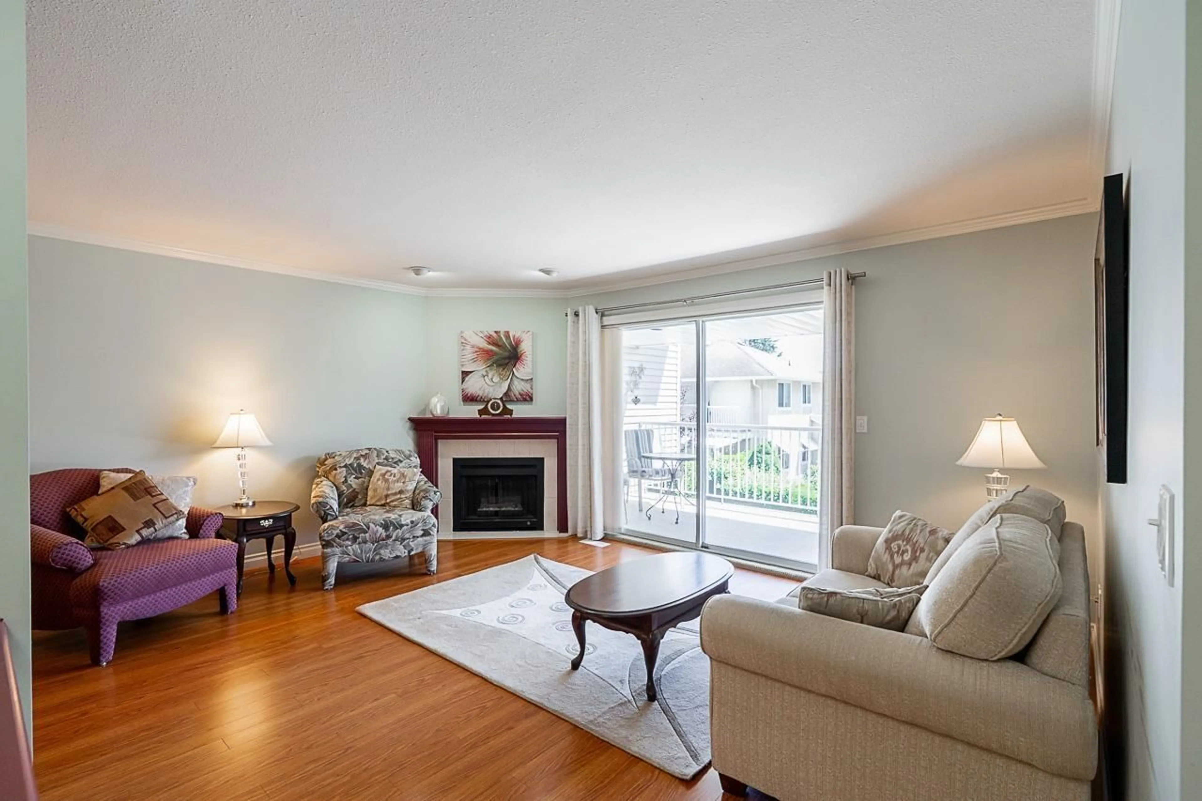 Living room with furniture, wood/laminate floor for 12 - 32615 MURRAY AVENUE, Abbotsford British Columbia V2T4T8