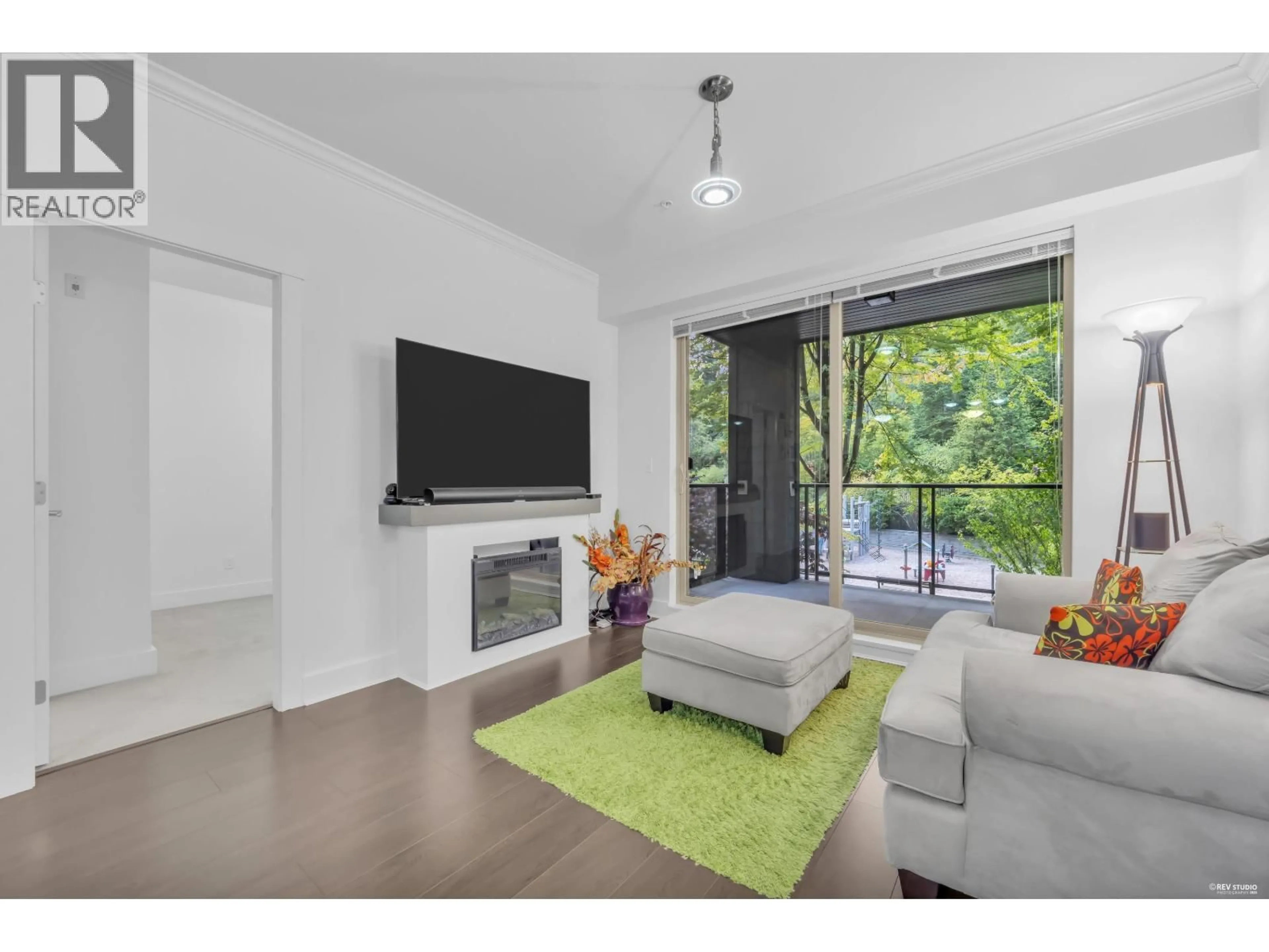 Living room with furniture, wood/laminate floor for 203 - 7418 BYRNEPARK WALK, Burnaby British Columbia V3N0B3