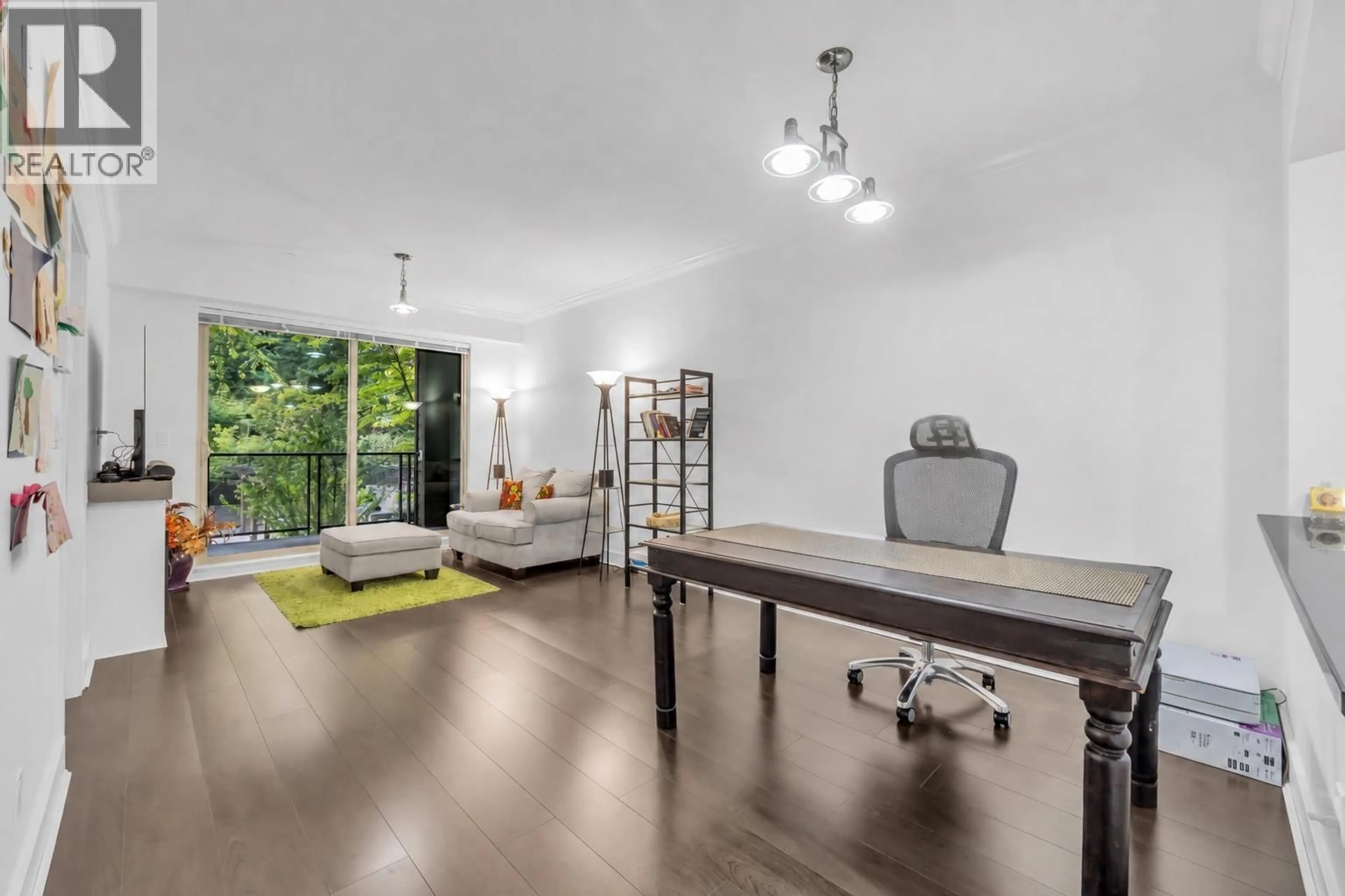 Living room with furniture, wood/laminate floor for 203 - 7418 BYRNEPARK WALK, Burnaby British Columbia V3N0B3