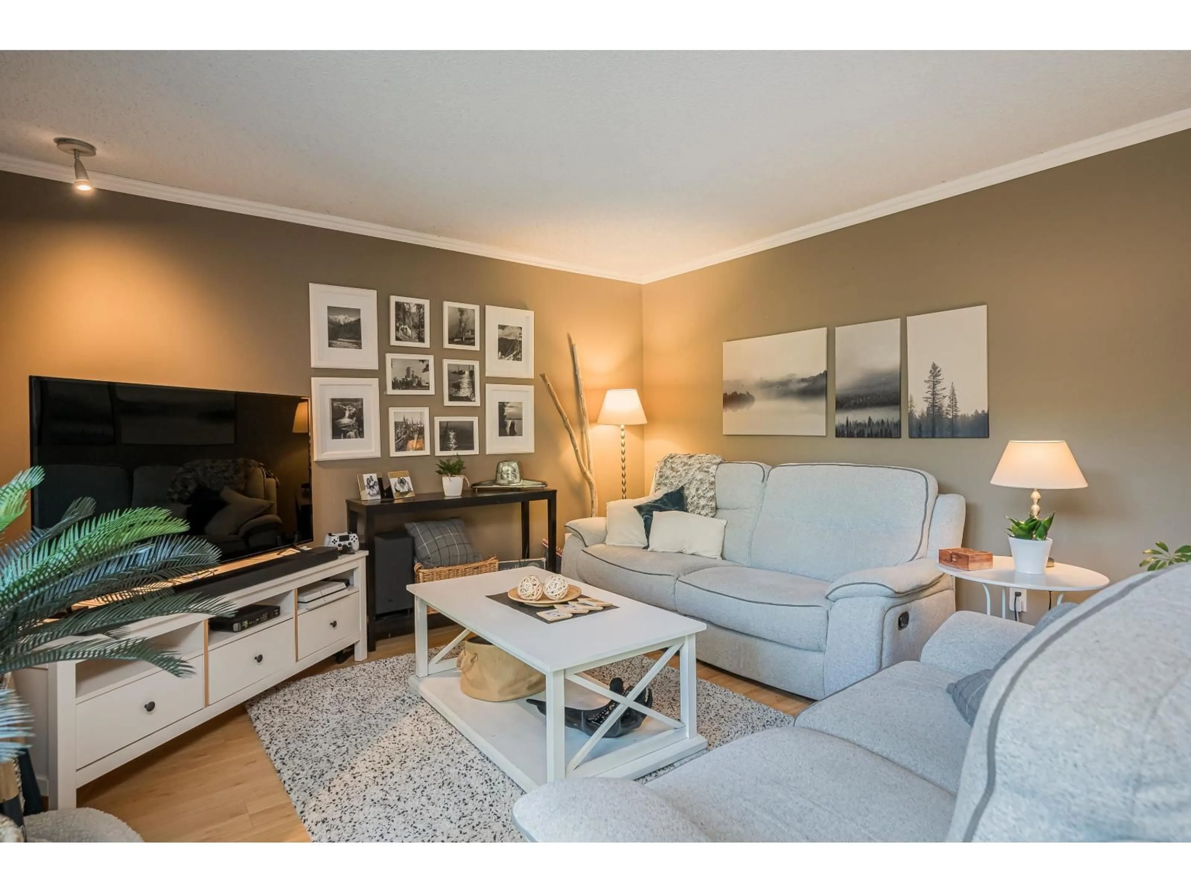 Living room with furniture, wood/laminate floor for 14603 101A AVENUE, Surrey British Columbia V3R7E2