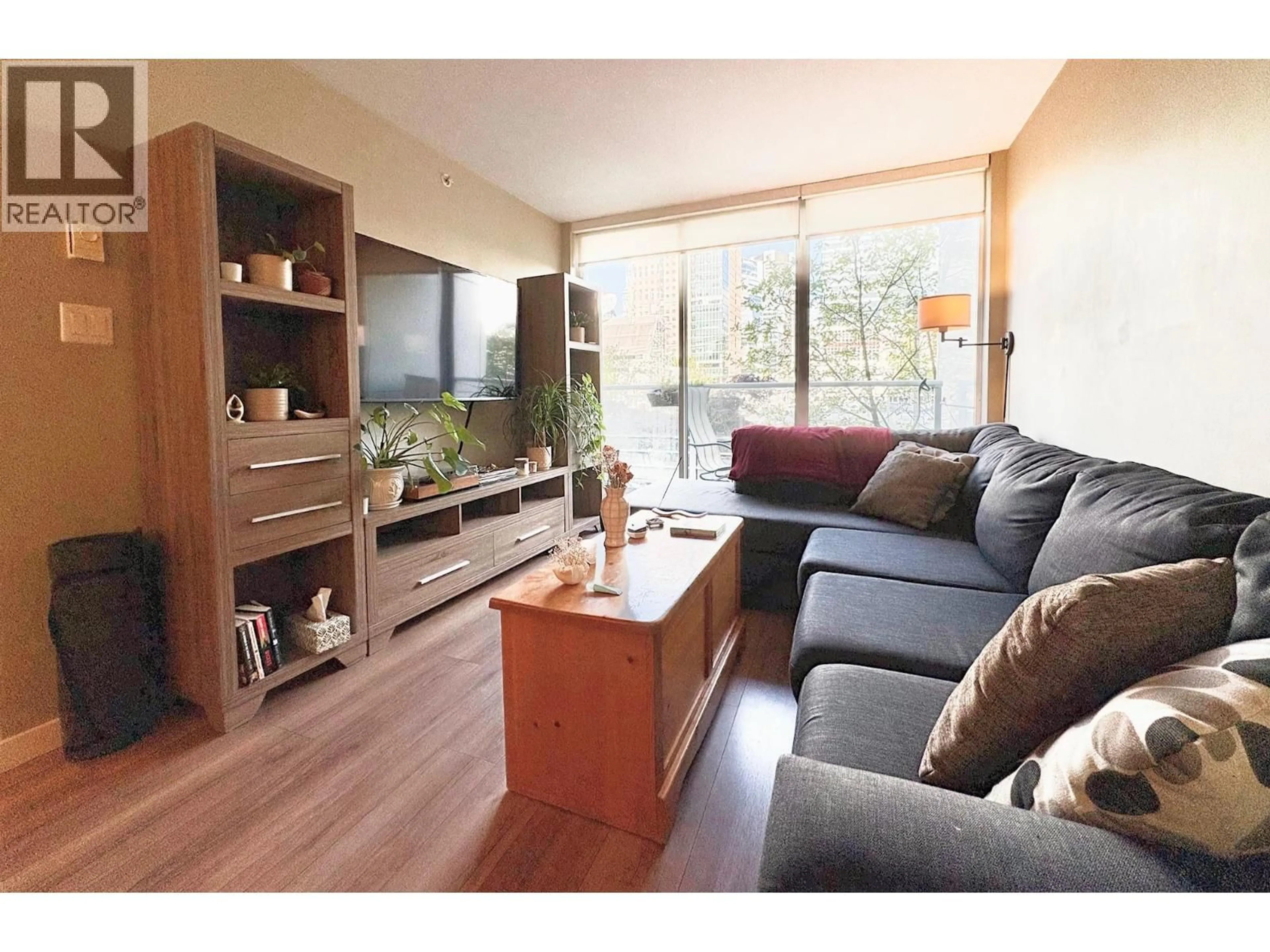 Living room with furniture, wood/laminate floor for 308 - 161 GEORGIA STREET, Vancouver British Columbia V6B0K9