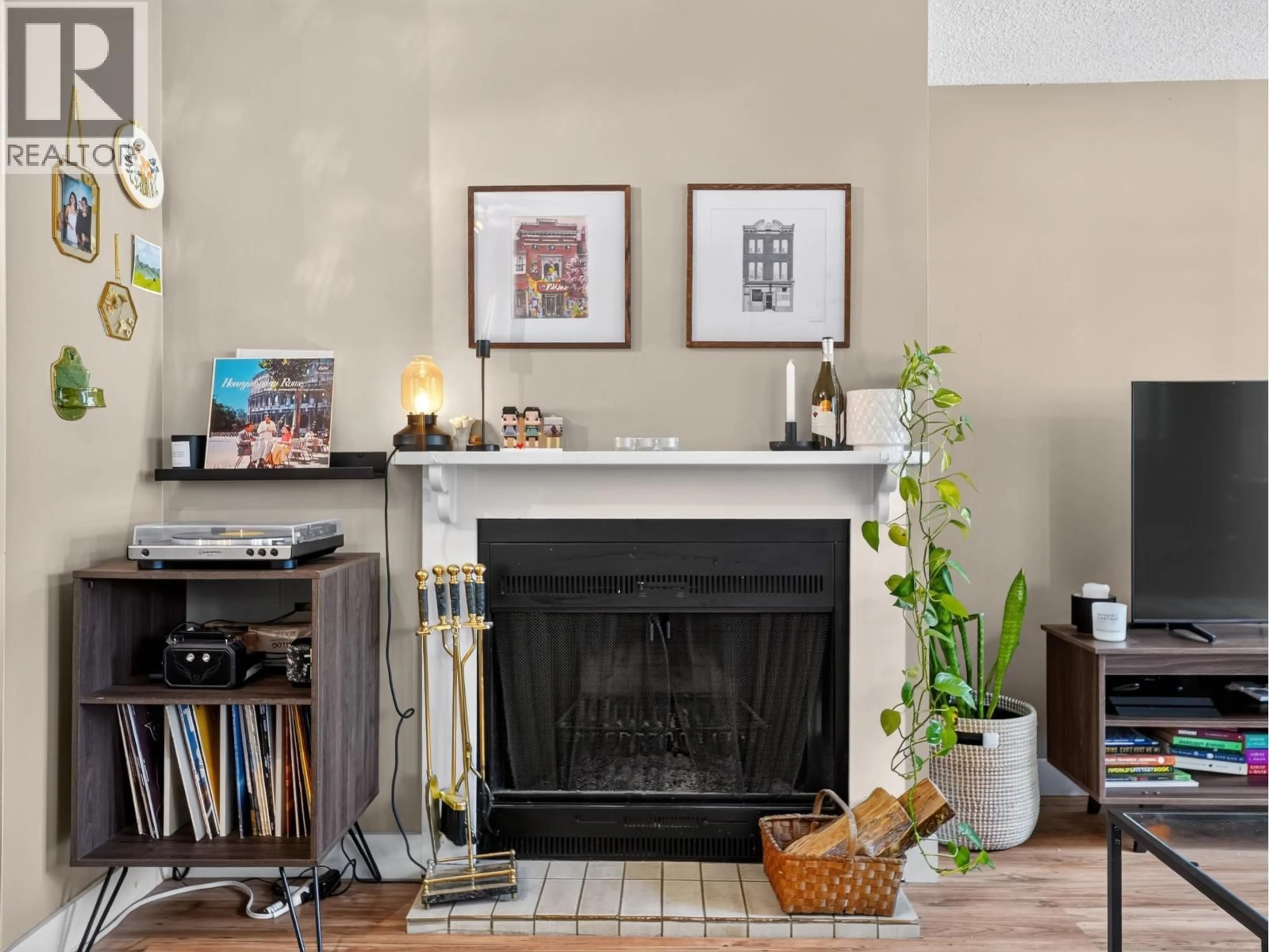 Living room with furniture, wood/laminate floor for 202 - 936 BUTE STREET, Vancouver British Columbia V6E1Y8