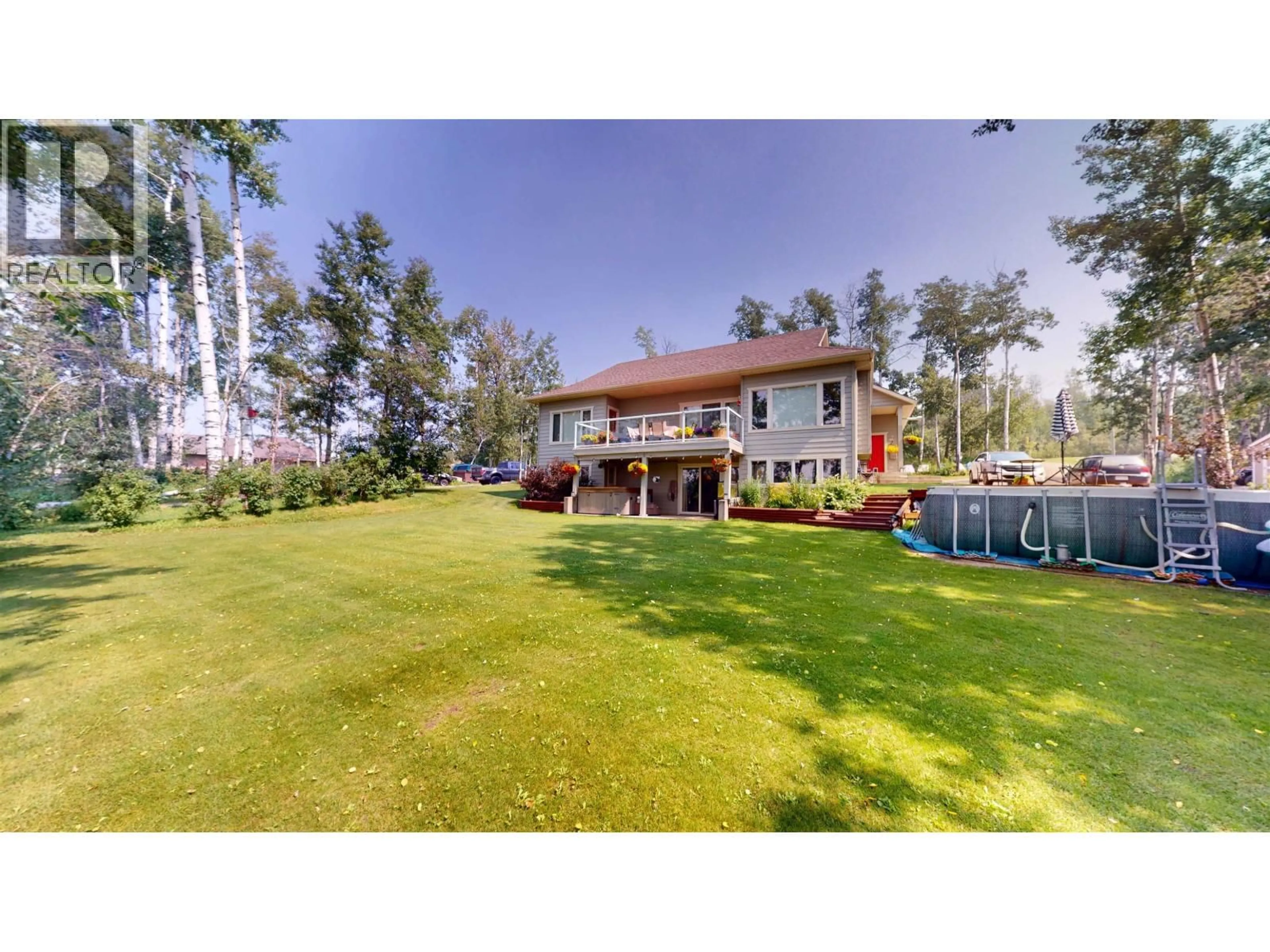 A pic from outside/outdoor area/front of a property/back of a property/a pic from drone, water/lake/river/ocean view for 13133 PARADISE LANE, Charlie Lake British Columbia V0C1H0