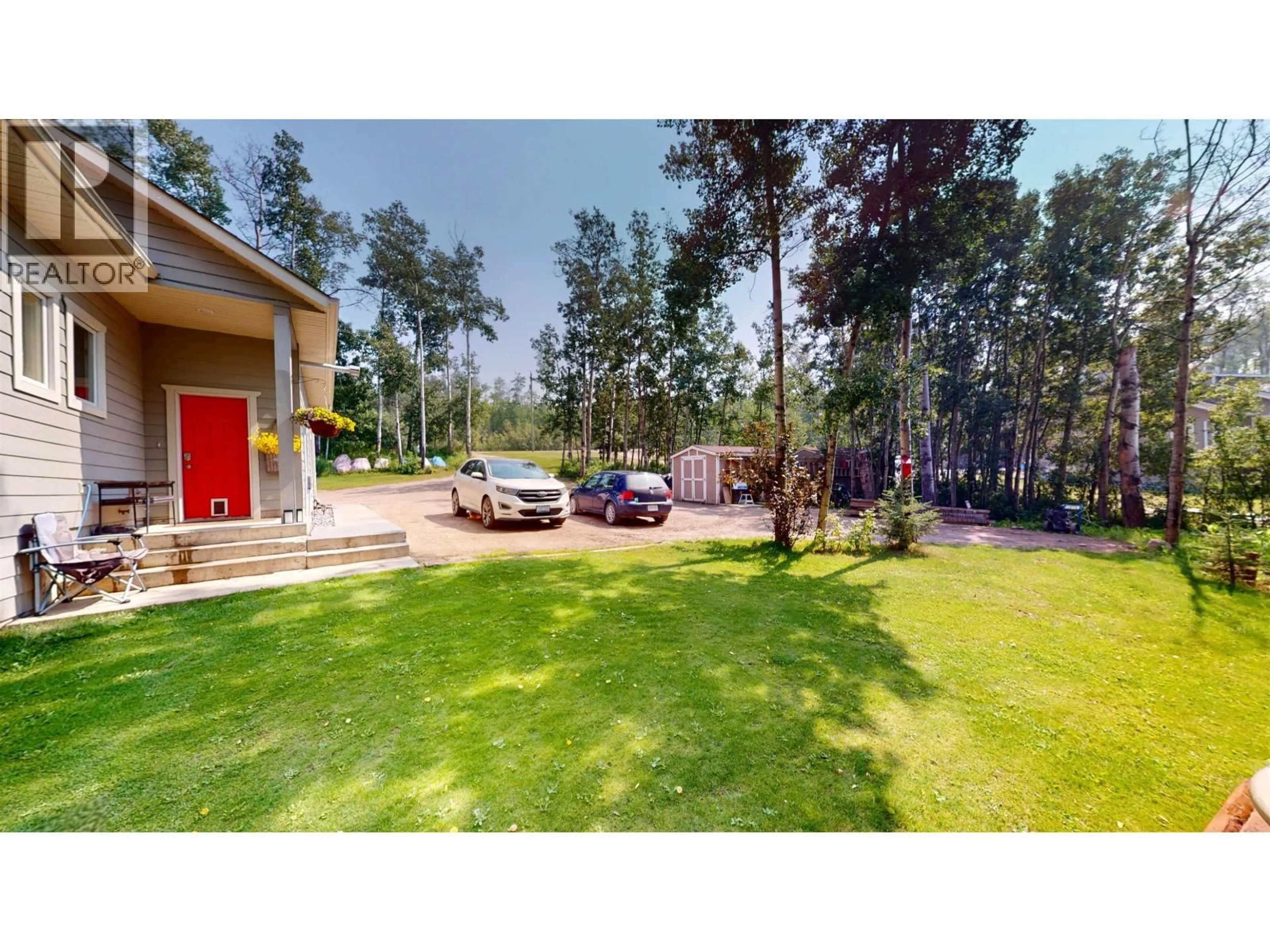 A pic from outside/outdoor area/front of a property/back of a property/a pic from drone, forest/trees view for 13133 PARADISE LANE, Charlie Lake British Columbia V0C1H0