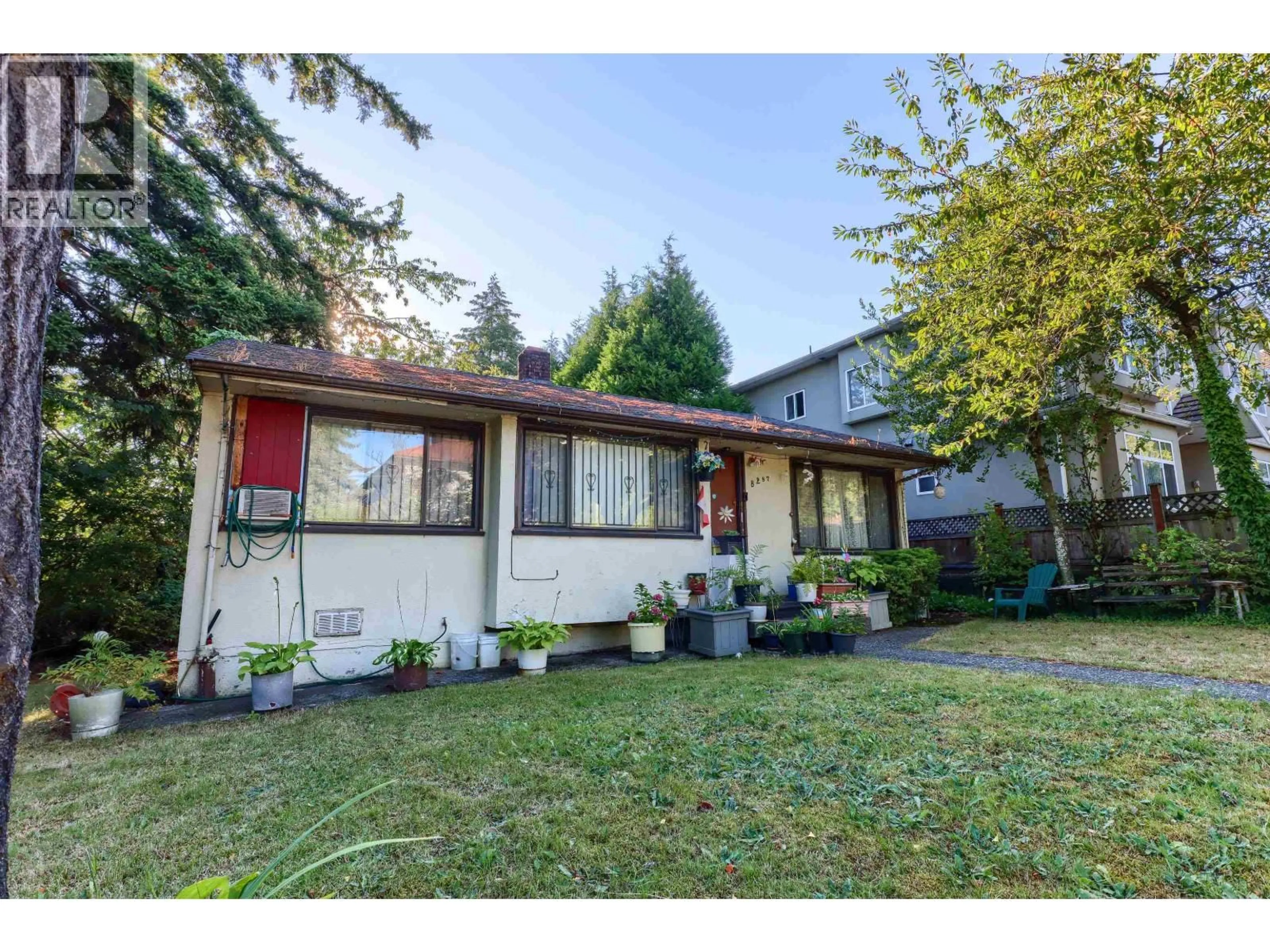 Home with vinyl exterior material, street for 8287 VICTORIA DRIVE, Vancouver British Columbia V5P4A7