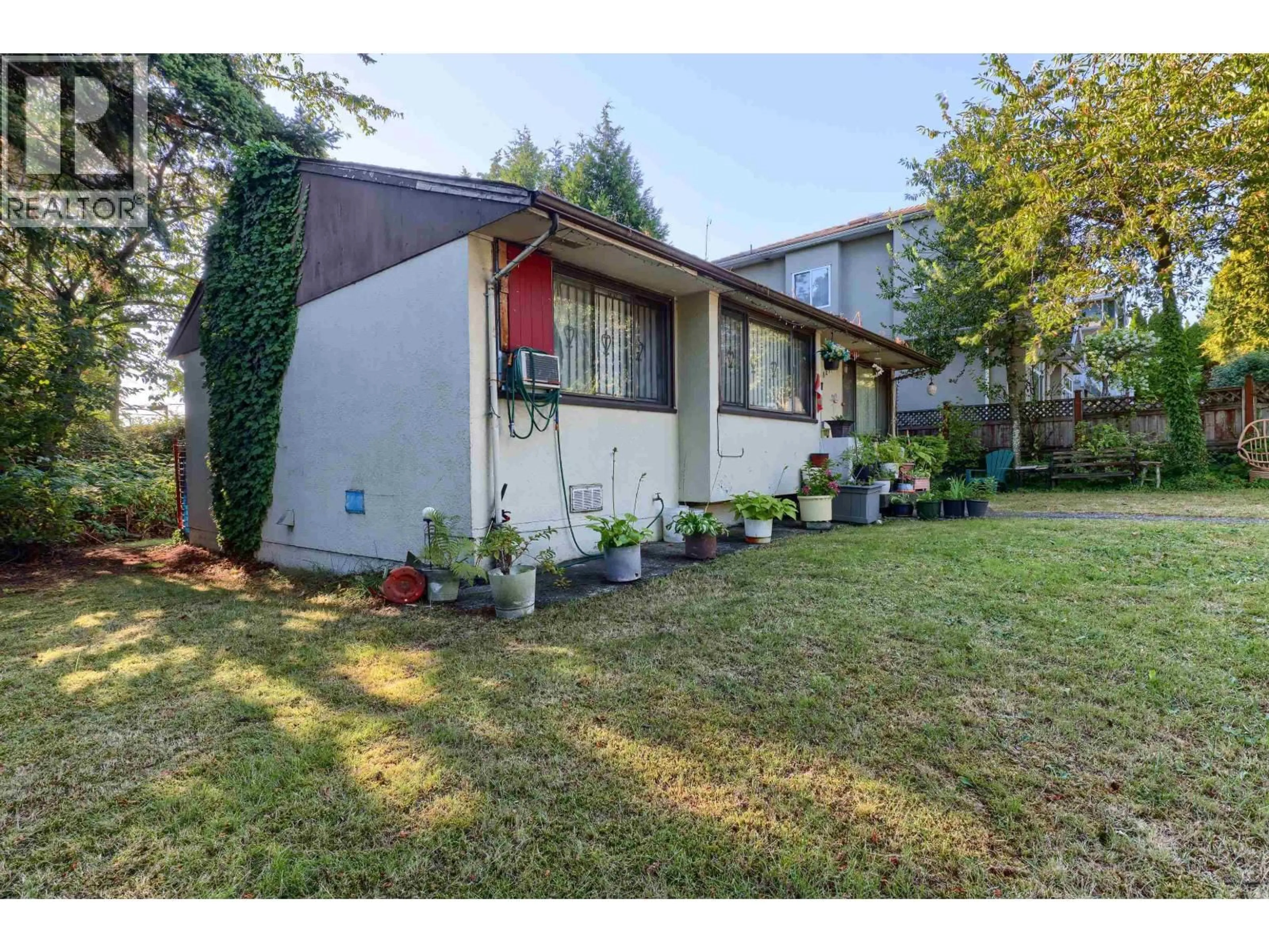 Home with vinyl exterior material, street for 8287 VICTORIA DRIVE, Vancouver British Columbia V5P4A7
